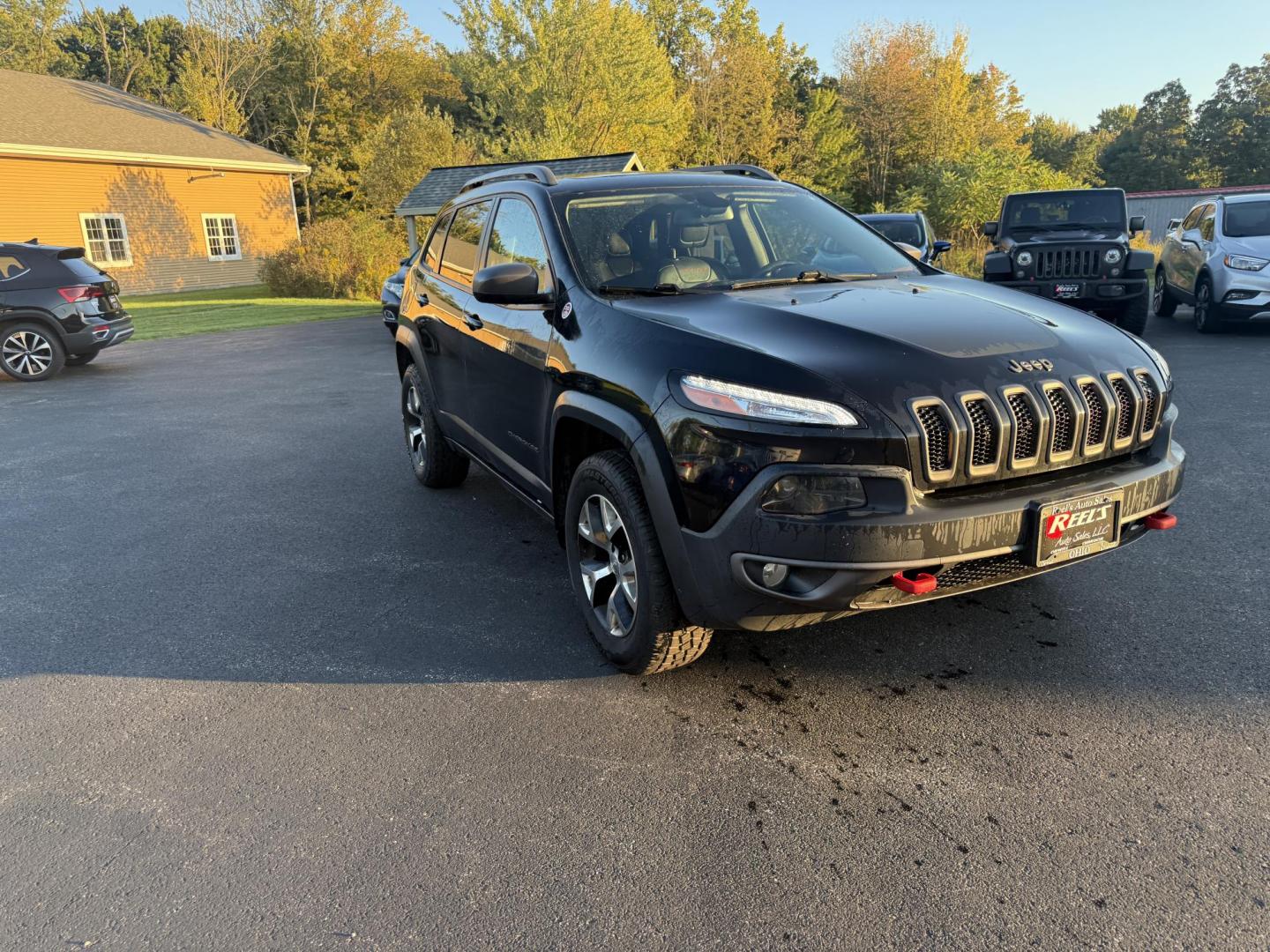 2016 Black /Black Jeep Cherokee Trailhawk 4WD (1C4PJMBS1GW) with an 3.2L V6 DOHC 24V engine, 9A transmission, located at 11115 Chardon Rd. , Chardon, OH, 44024, (440) 214-9705, 41.580246, -81.241943 - This 2016 Jeep Cherokee Trailhawk 4WD is powered by a robust 3.2L V6 engine paired with a 9-speed automatic transmission, delivering strong off-road capability with features like Jeep Active Drive Lock and a locking rear differential. Inside, it offers a leather interior, heated front seats, power d - Photo#2