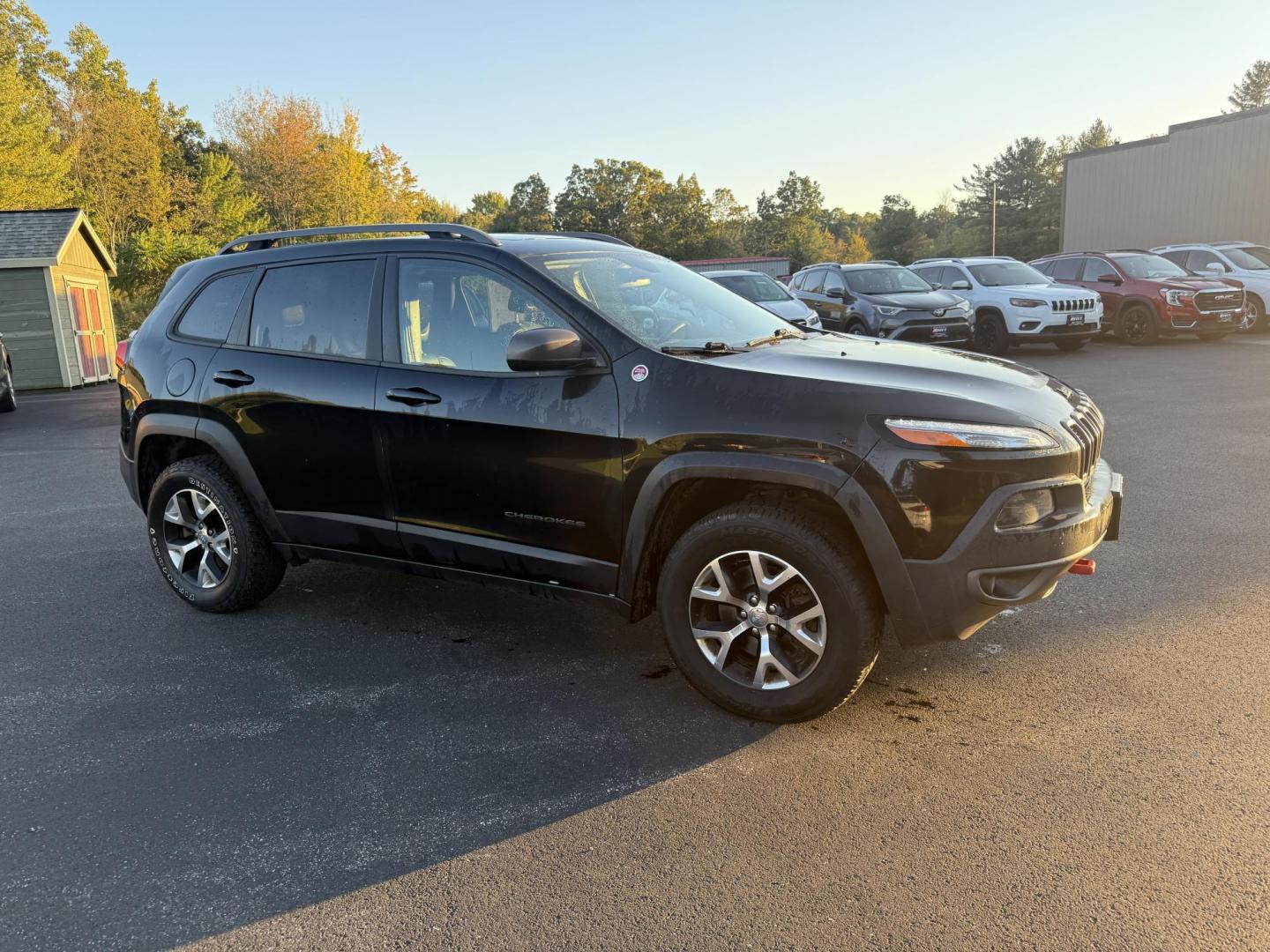 2016 Black /Black Jeep Cherokee Trailhawk 4WD (1C4PJMBS1GW) with an 3.2L V6 DOHC 24V engine, 9A transmission, located at 11115 Chardon Rd. , Chardon, OH, 44024, (440) 214-9705, 41.580246, -81.241943 - This 2016 Jeep Cherokee Trailhawk 4WD is powered by a robust 3.2L V6 engine paired with a 9-speed automatic transmission, delivering strong off-road capability with features like Jeep Active Drive Lock and a locking rear differential. Inside, it offers a leather interior, heated front seats, power d - Photo#3