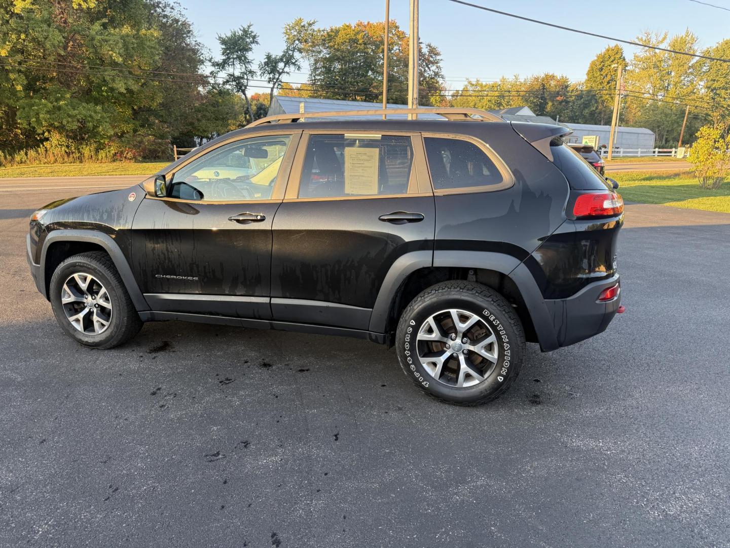 2016 Black /Black Jeep Cherokee Trailhawk 4WD (1C4PJMBS1GW) with an 3.2L V6 DOHC 24V engine, 9A transmission, located at 11115 Chardon Rd. , Chardon, OH, 44024, (440) 214-9705, 41.580246, -81.241943 - This 2016 Jeep Cherokee Trailhawk 4WD is powered by a robust 3.2L V6 engine paired with a 9-speed automatic transmission, delivering strong off-road capability with features like Jeep Active Drive Lock and a locking rear differential. Inside, it offers a leather interior, heated front seats, power d - Photo#11
