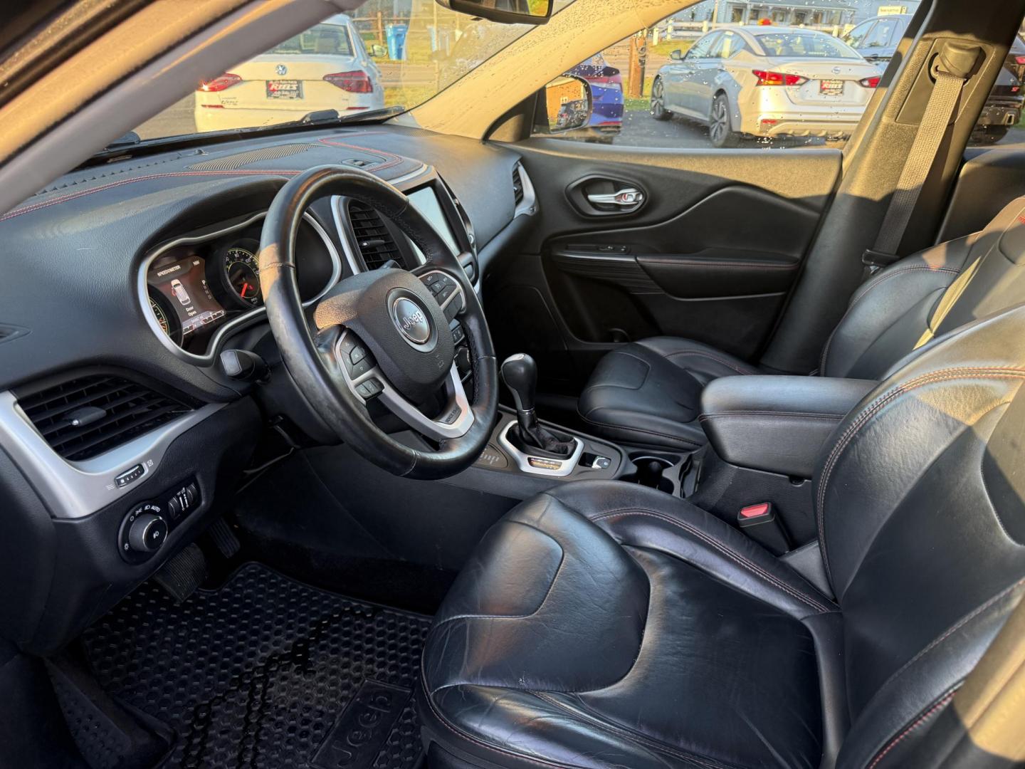 2016 Black /Black Jeep Cherokee Trailhawk 4WD (1C4PJMBS1GW) with an 3.2L V6 DOHC 24V engine, 9A transmission, located at 11115 Chardon Rd. , Chardon, OH, 44024, (440) 214-9705, 41.580246, -81.241943 - This 2016 Jeep Cherokee Trailhawk 4WD is powered by a robust 3.2L V6 engine paired with a 9-speed automatic transmission, delivering strong off-road capability with features like Jeep Active Drive Lock and a locking rear differential. Inside, it offers a leather interior, heated front seats, power d - Photo#16