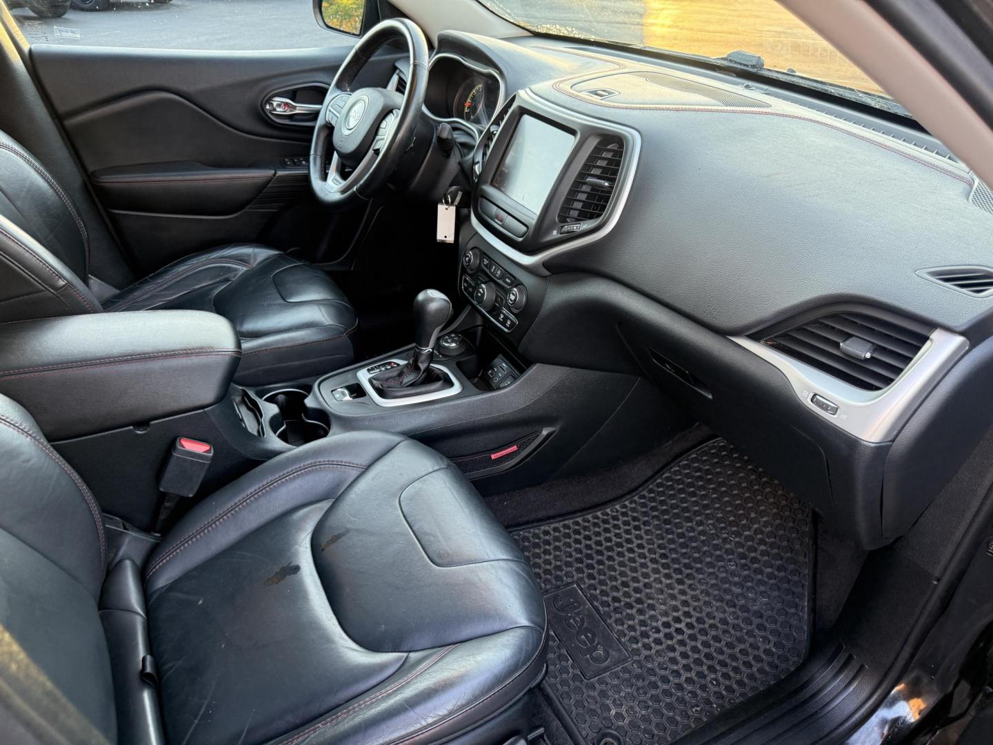 2016 Black /Black Jeep Cherokee Trailhawk 4WD (1C4PJMBS1GW) with an 3.2L V6 DOHC 24V engine, 9A transmission, located at 11115 Chardon Rd. , Chardon, OH, 44024, (440) 214-9705, 41.580246, -81.241943 - This 2016 Jeep Cherokee Trailhawk 4WD is powered by a robust 3.2L V6 engine paired with a 9-speed automatic transmission, delivering strong off-road capability with features like Jeep Active Drive Lock and a locking rear differential. Inside, it offers a leather interior, heated front seats, power d - Photo#45