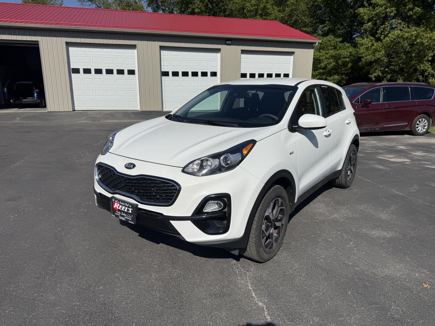 2020 White /Black Kia Sportage LX AWD (KNDPMCAC2L7) with an 2.4L I4 DOHC 24V engine, 6A transmission, located at 547 E. Main St., Orwell, OH, 44076, (440) 437-5893, 41.535435, -80.847855 - This One Owner 2020 Kia Sportage LX AWD is a versatile and well-equipped compact SUV designed to provide confidence and comfort in a wide range of driving conditions. Powered by a 2.4-liter I4 GDI engine paired with a 6-speed automatic transmission, this Sportage LX offers responsive acceleration an - Photo#0