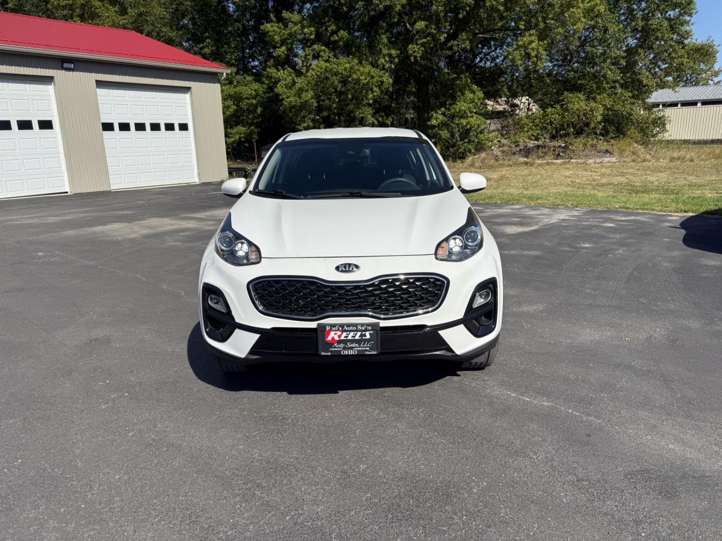 2020 White /Black Kia Sportage LX AWD (KNDPMCAC2L7) with an 2.4L I4 DOHC 24V engine, 6A transmission, located at 547 E. Main St., Orwell, OH, 44076, (440) 437-5893, 41.535435, -80.847855 - This One Owner 2020 Kia Sportage LX AWD is a versatile and well-equipped compact SUV designed to provide confidence and comfort in a wide range of driving conditions. Powered by a 2.4-liter I4 GDI engine paired with a 6-speed automatic transmission, this Sportage LX offers responsive acceleration an - Photo#1