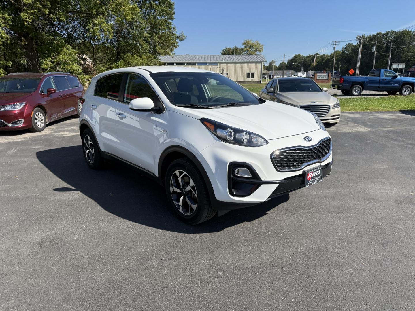 2020 White /Black Kia Sportage LX AWD (KNDPMCAC2L7) with an 2.4L I4 DOHC 24V engine, 6A transmission, located at 547 E. Main St., Orwell, OH, 44076, (440) 437-5893, 41.535435, -80.847855 - This One Owner 2020 Kia Sportage LX AWD is a versatile and well-equipped compact SUV designed to provide confidence and comfort in a wide range of driving conditions. Powered by a 2.4-liter I4 GDI engine paired with a 6-speed automatic transmission, this Sportage LX offers responsive acceleration an - Photo#2