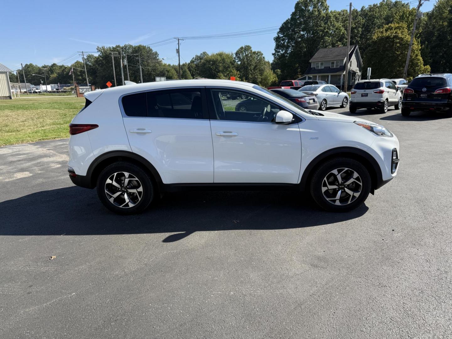 2020 White /Black Kia Sportage LX AWD (KNDPMCAC2L7) with an 2.4L I4 DOHC 24V engine, 6A transmission, located at 547 E. Main St., Orwell, OH, 44076, (440) 437-5893, 41.535435, -80.847855 - This One Owner 2020 Kia Sportage LX AWD is a versatile and well-equipped compact SUV designed to provide confidence and comfort in a wide range of driving conditions. Powered by a 2.4-liter I4 GDI engine paired with a 6-speed automatic transmission, this Sportage LX offers responsive acceleration an - Photo#5