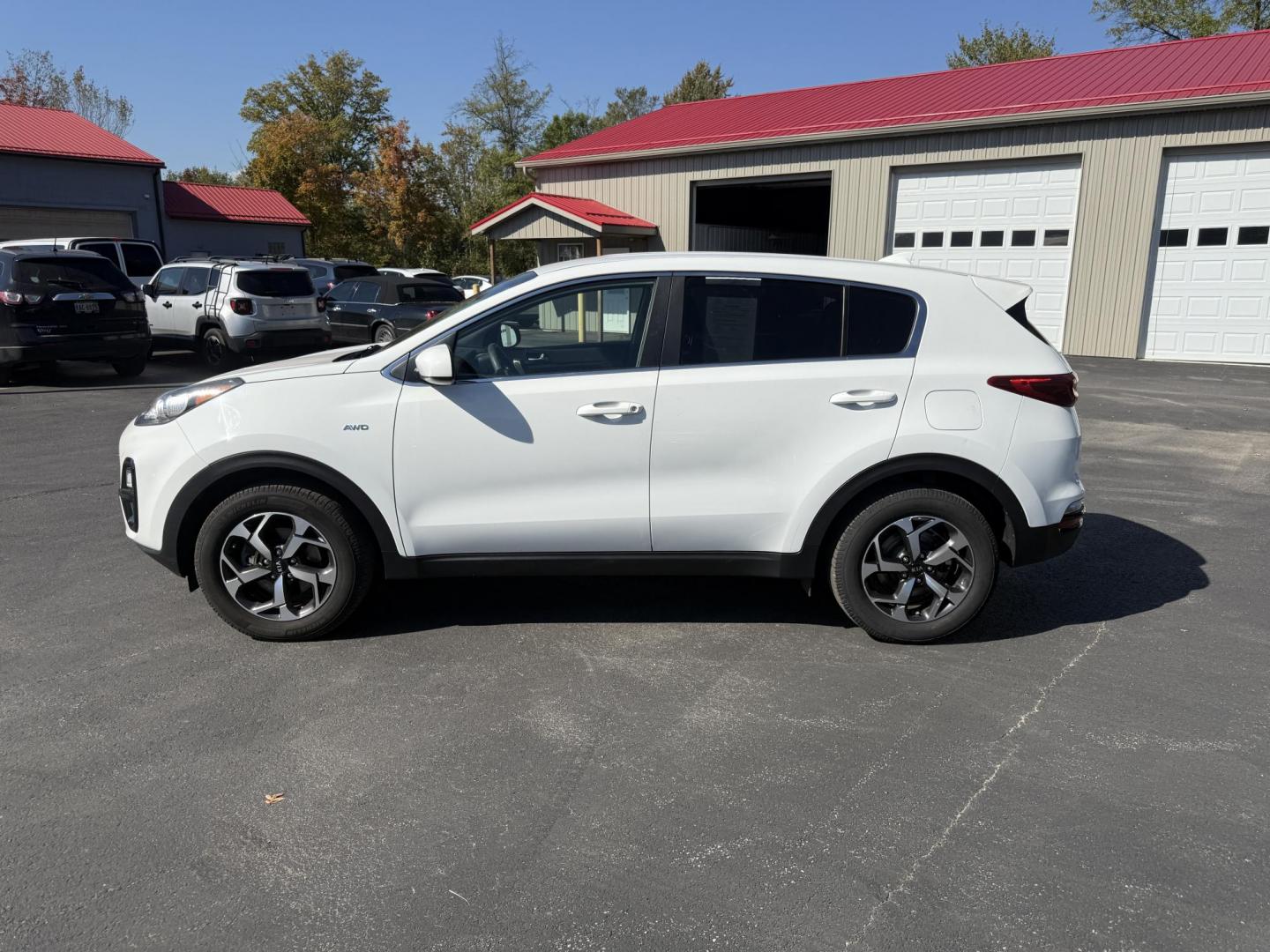 2020 White /Black Kia Sportage LX AWD (KNDPMCAC2L7) with an 2.4L I4 DOHC 24V engine, 6A transmission, located at 547 E. Main St., Orwell, OH, 44076, (440) 437-5893, 41.535435, -80.847855 - This One Owner 2020 Kia Sportage LX AWD is a versatile and well-equipped compact SUV designed to provide confidence and comfort in a wide range of driving conditions. Powered by a 2.4-liter I4 GDI engine paired with a 6-speed automatic transmission, this Sportage LX offers responsive acceleration an - Photo#12