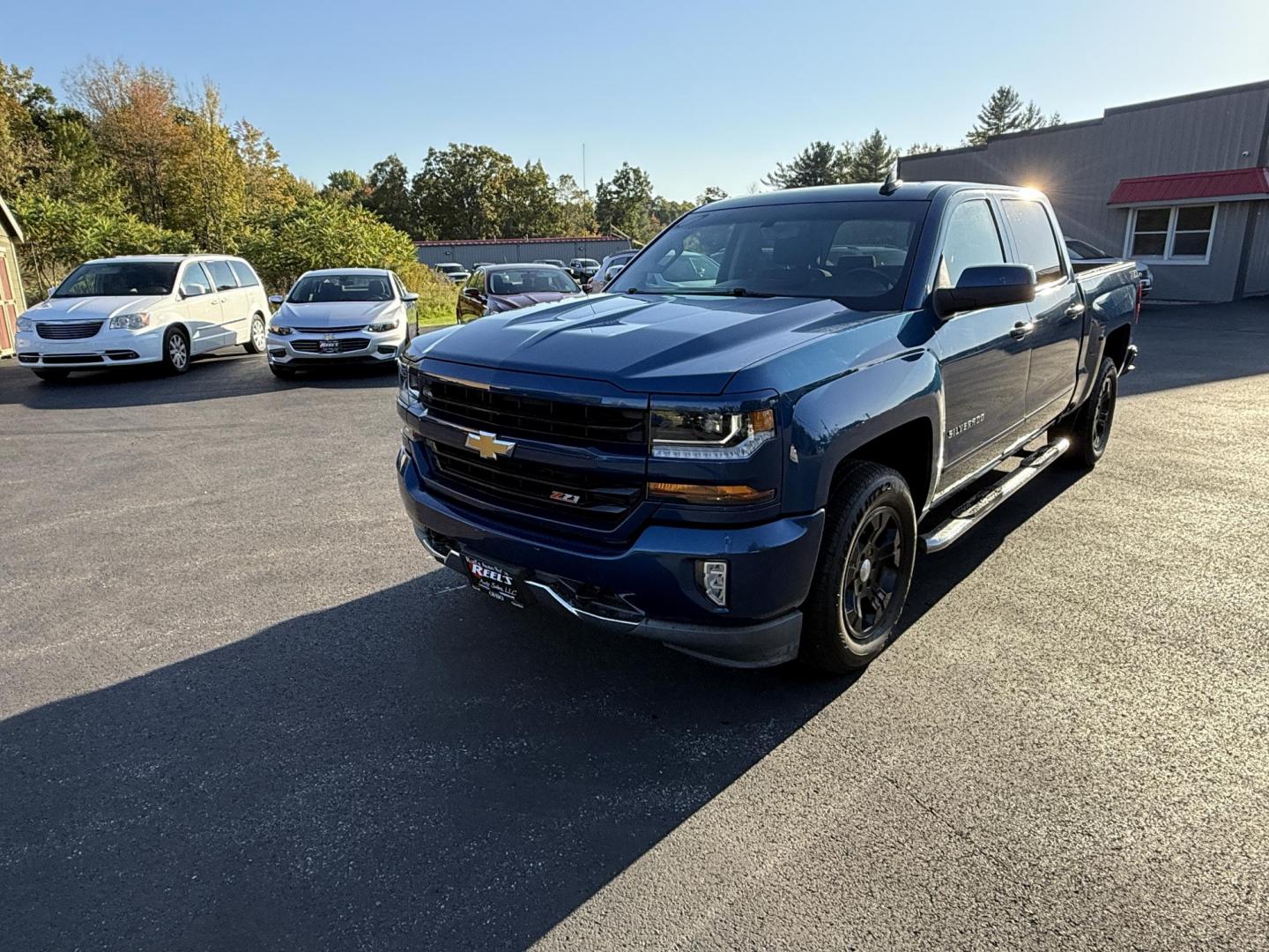 2018 Blue /Black Chevrolet Silverado 1500 LT Z71 Crew Cab Short Box 4WD (3GCUKRECXJG) with an 5.3L V8 OHV 16V engine, 6A transmission, located at 11115 Chardon Rd. , Chardon, OH, 44024, (440) 214-9705, 41.580246, -81.241943 - Rugged, reliable, and ready for work or play, this 2018 Chevrolet Silverado 1500 LT Z71 Crew Cab is the perfect blend of power, capability, and comfort. Under the hood, it boasts a proven 5.3-liter EcoTec3 V8 engine paired with a smooth 6-speed automatic transmission and 3.42 rear axle gearing, offe - Photo#0