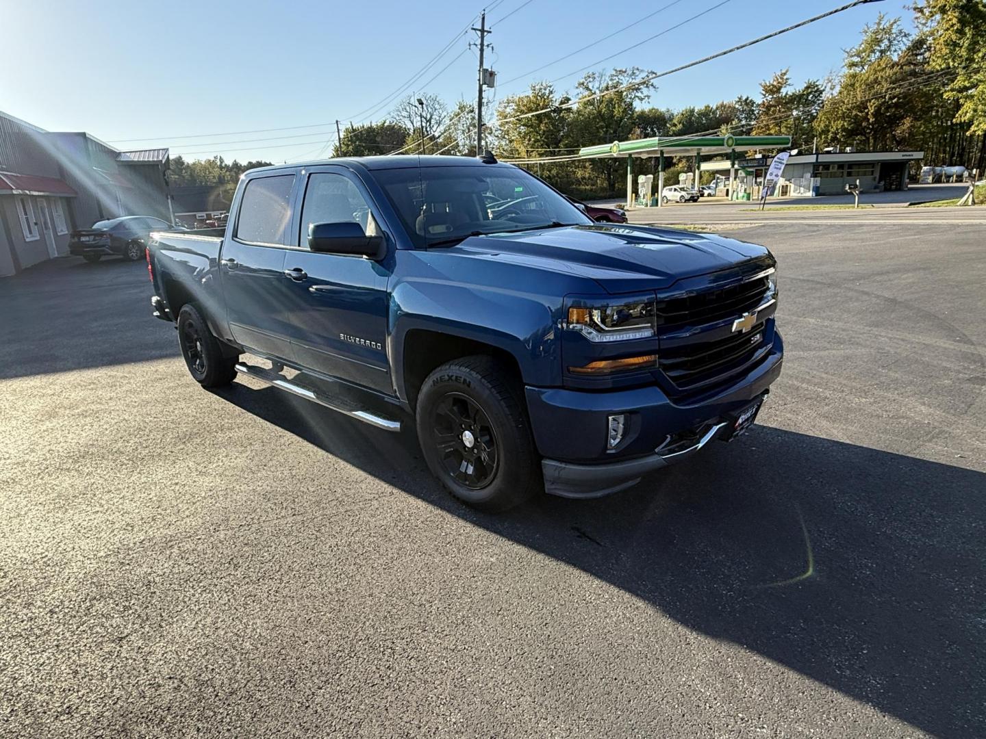 2018 Blue /Black Chevrolet Silverado 1500 LT Z71 Crew Cab Short Box 4WD (3GCUKRECXJG) with an 5.3L V8 OHV 16V engine, 6A transmission, located at 11115 Chardon Rd. , Chardon, OH, 44024, (440) 214-9705, 41.580246, -81.241943 - Rugged, reliable, and ready for work or play, this 2018 Chevrolet Silverado 1500 LT Z71 Crew Cab is the perfect blend of power, capability, and comfort. Under the hood, it boasts a proven 5.3-liter EcoTec3 V8 engine paired with a smooth 6-speed automatic transmission and 3.42 rear axle gearing, offe - Photo#2