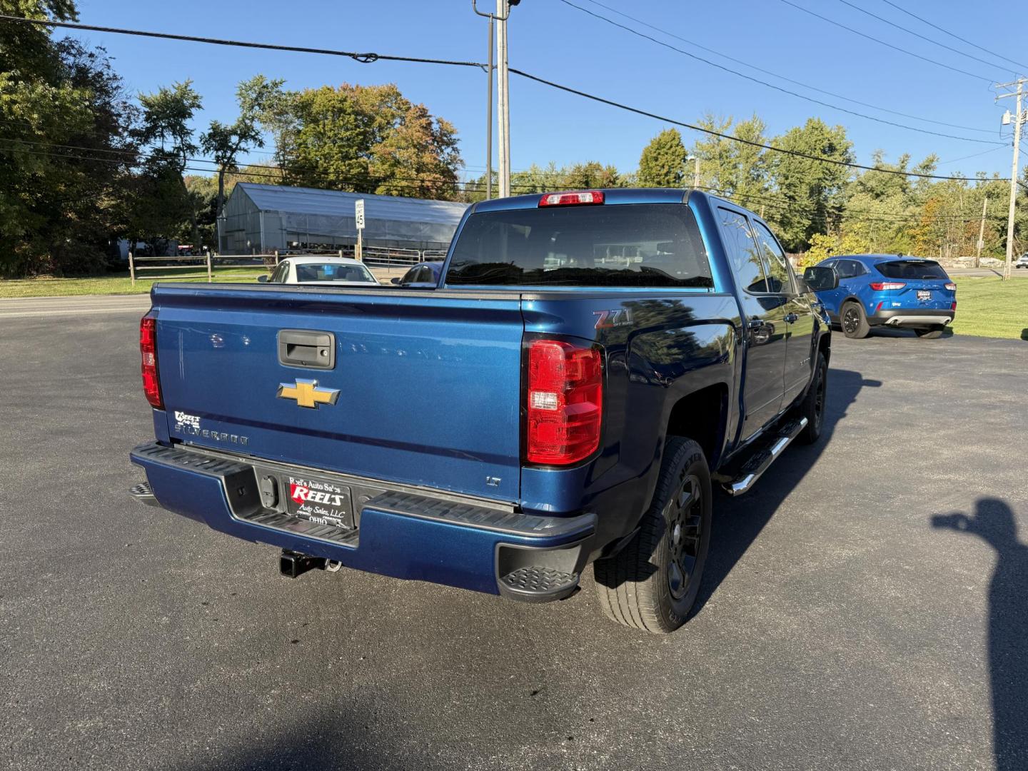 2018 Blue /Black Chevrolet Silverado 1500 LT Z71 Crew Cab Short Box 4WD (3GCUKRECXJG) with an 5.3L V8 OHV 16V engine, 6A transmission, located at 11115 Chardon Rd. , Chardon, OH, 44024, (440) 214-9705, 41.580246, -81.241943 - Rugged, reliable, and ready for work or play, this 2018 Chevrolet Silverado 1500 LT Z71 Crew Cab is the perfect blend of power, capability, and comfort. Under the hood, it boasts a proven 5.3-liter EcoTec3 V8 engine paired with a smooth 6-speed automatic transmission and 3.42 rear axle gearing, offe - Photo#7