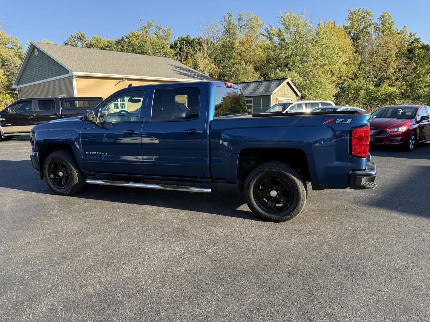 2018 Blue /Black Chevrolet Silverado 1500 LT Z71 Crew Cab Short Box 4WD (3GCUKRECXJG) with an 5.3L V8 OHV 16V engine, 6A transmission, located at 11115 Chardon Rd. , Chardon, OH, 44024, (440) 214-9705, 41.580246, -81.241943 - Rugged, reliable, and ready for work or play, this 2018 Chevrolet Silverado 1500 LT Z71 Crew Cab is the perfect blend of power, capability, and comfort. Under the hood, it boasts a proven 5.3-liter EcoTec3 V8 engine paired with a smooth 6-speed automatic transmission and 3.42 rear axle gearing, offe - Photo#10
