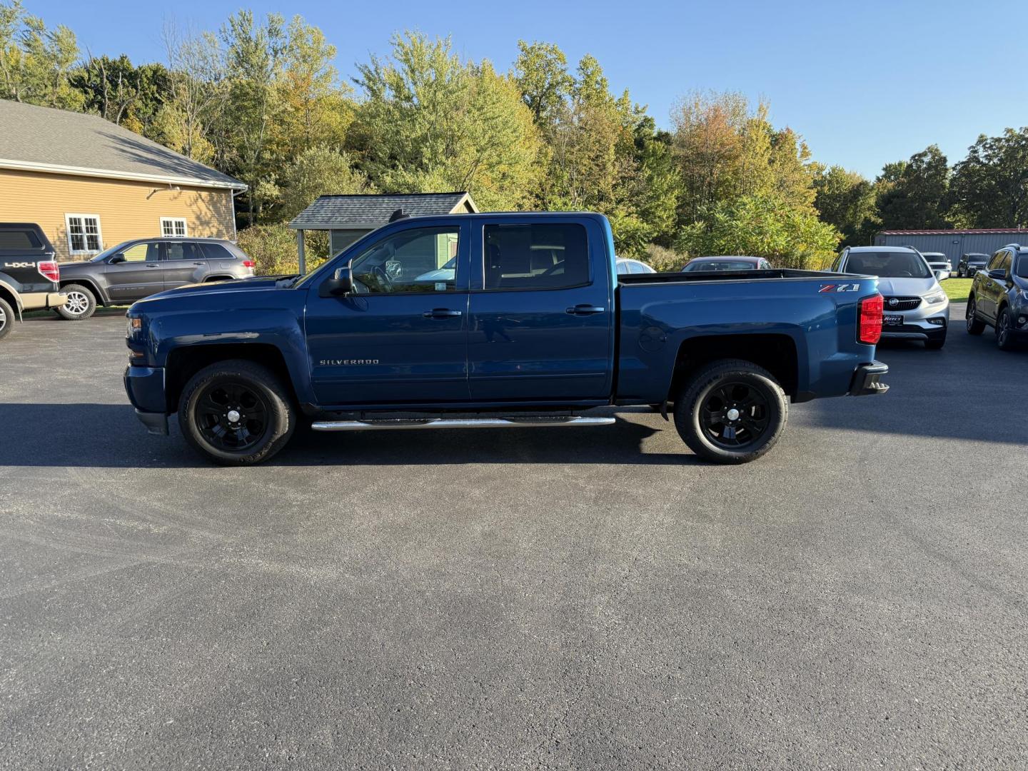 2018 Blue /Black Chevrolet Silverado 1500 LT Z71 Crew Cab Short Box 4WD (3GCUKRECXJG) with an 5.3L V8 OHV 16V engine, 6A transmission, located at 11115 Chardon Rd. , Chardon, OH, 44024, (440) 214-9705, 41.580246, -81.241943 - Rugged, reliable, and ready for work or play, this 2018 Chevrolet Silverado 1500 LT Z71 Crew Cab is the perfect blend of power, capability, and comfort. Under the hood, it boasts a proven 5.3-liter EcoTec3 V8 engine paired with a smooth 6-speed automatic transmission and 3.42 rear axle gearing, offe - Photo#12