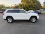 2014 White /Black Jeep Grand Cherokee Laredo 4WD (1C4RJFAG1EC) with an 3.6L V6 DOHC 24V FFV engine, 8-Speed Automatic transmission, located at 11115 Chardon Rd. , Chardon, OH, 44024, (440) 214-9705, 41.580246, -81.241943 - This 2014 Jeep Grand Cherokee Laredo 4WD delivers a great mix of capability, efficiency, and comfort. Powered by the reliable 3.6L Pentastar V6 engine paired with an 8-speed automatic transmission, it offers smooth performance and up to 24 MPG on the highway. With 4WD and a 3,500-pound towing capaci - Photo#5