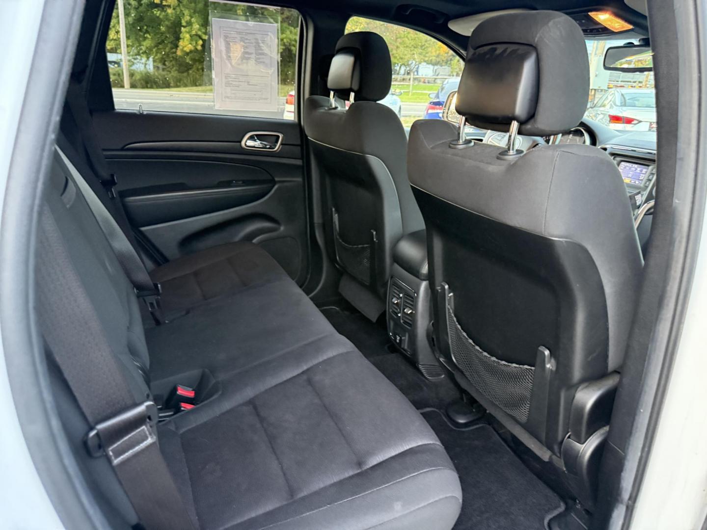 2014 White /Black Jeep Grand Cherokee Laredo 4WD (1C4RJFAG1EC) with an 3.6L V6 DOHC 24V FFV engine, 8-Speed Automatic transmission, located at 11115 Chardon Rd. , Chardon, OH, 44024, (440) 214-9705, 41.580246, -81.241943 - This 2014 Jeep Grand Cherokee Laredo 4WD delivers a great mix of capability, efficiency, and comfort. Powered by the reliable 3.6L Pentastar V6 engine paired with an 8-speed automatic transmission, it offers smooth performance and up to 24 MPG on the highway. With 4WD and a 3,500-pound towing capaci - Photo#37