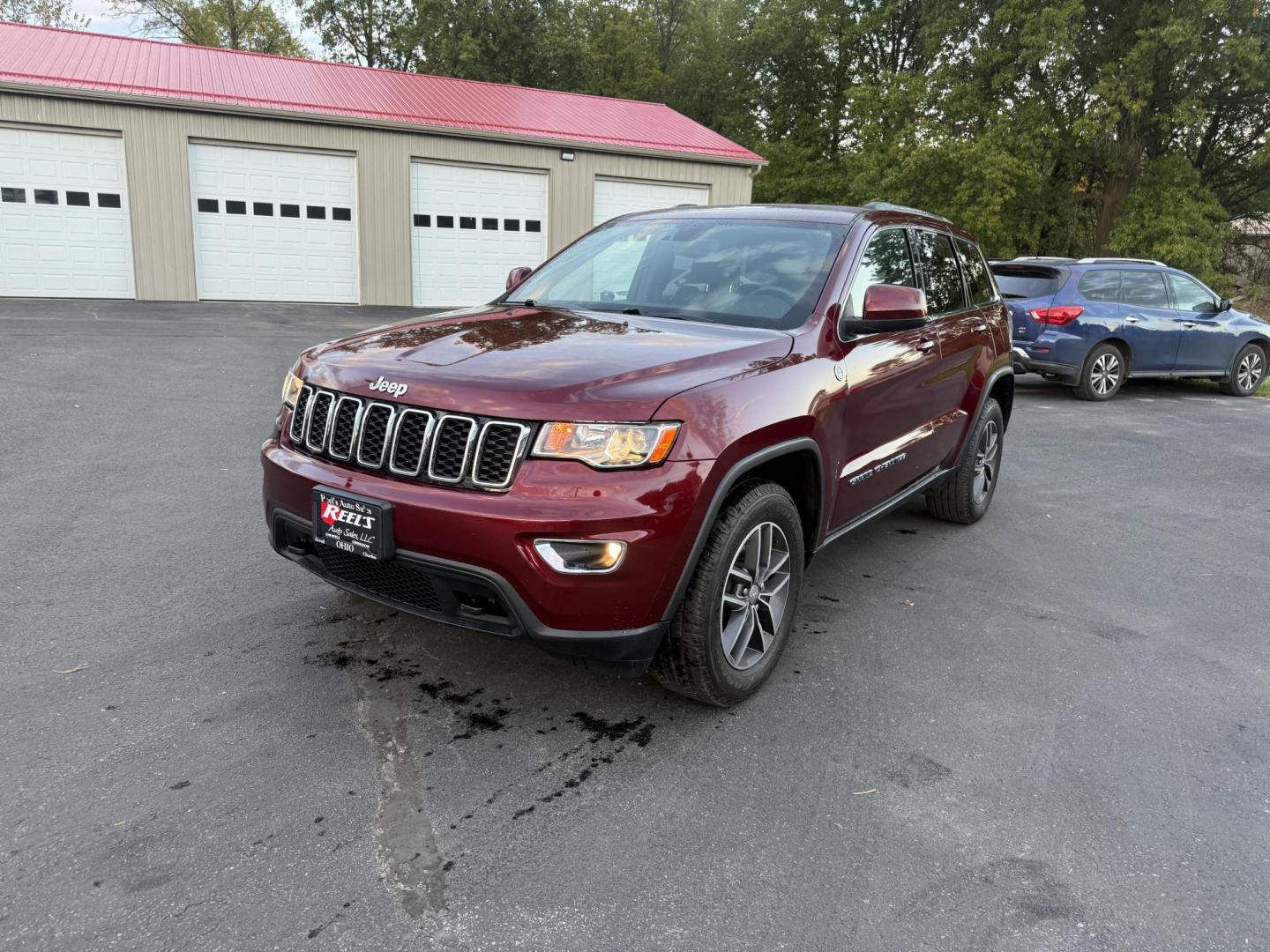 2018 Red /Black Jeep Grand Cherokee Laredo E 4WD (1C4RJFAG9JC) with an 3.6L V6 DOHC 24V engine, 8A transmission, located at 547 E. Main St., Orwell, OH, 44076, (440) 437-5893, 41.535435, -80.847855 - 2018 Jeep Grand Cherokee Laredo E – Trail Ready, Tech Loaded, and Built to Impress! Experience legendary Jeep capability and premium comfort with this 2018 Grand Cherokee Laredo E. Featuring the powerful and reliable 3.6L Pentastar V6 paired with an 8-speed automatic transmission, this SUV deliv - Photo#0