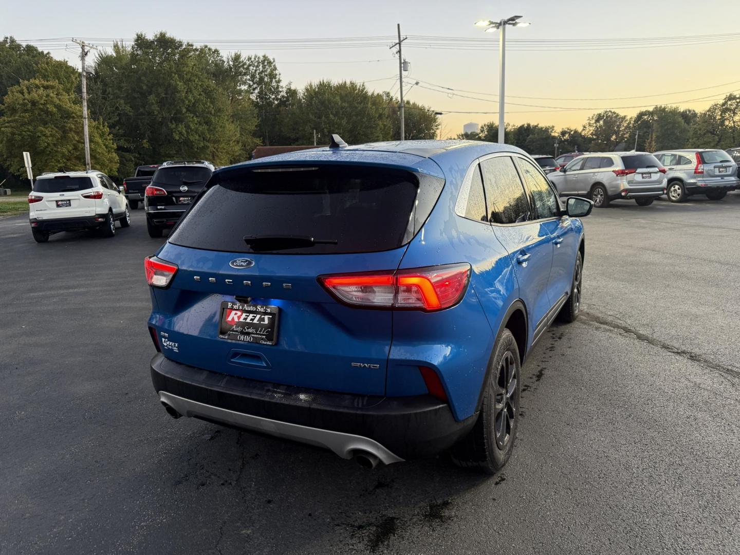 2020 Blue /Gray Ford Escape SE AWD (1FMCU9G62LU) with an 1.5L I3 DOHC 16V TURBO engine, 8-Speed Automatic transmission, located at 547 E. Main St., Orwell, OH, 44076, (440) 437-5893, 41.535435, -80.847855 - 2020 Ford Escape SE 4WD – Modern Style, Smart Technology, Unmatched Versatility Elevate your drive with this 2020 Ford Escape SE 4WD, a perfect blend of style, comfort, and cutting-edge technology. Enjoy the efficiency and power of its turbocharged engine and 8-speed automatic transmission, deliv - Photo#7