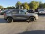 2022 Gray /Gray Ford Escape SE AWD (1FMCU9G6XNU) with an 1.5L I3 DOHC 16V TURBO engine, 8-Speed Automatic transmission, located at 547 E. Main St., Orwell, OH, 44076, (440) 437-5893, 41.535435, -80.847855 - Experience modern versatility and comfort with this 2022 Ford Escape SE 4WD. Powered by an efficient turbocharged EcoBoost engine and 8-speed automatic transmission, this SUV offers impressive fuel economy—up to 31 MPG on the highway. The well-equipped interior features heated front seats, a heate - Photo#5