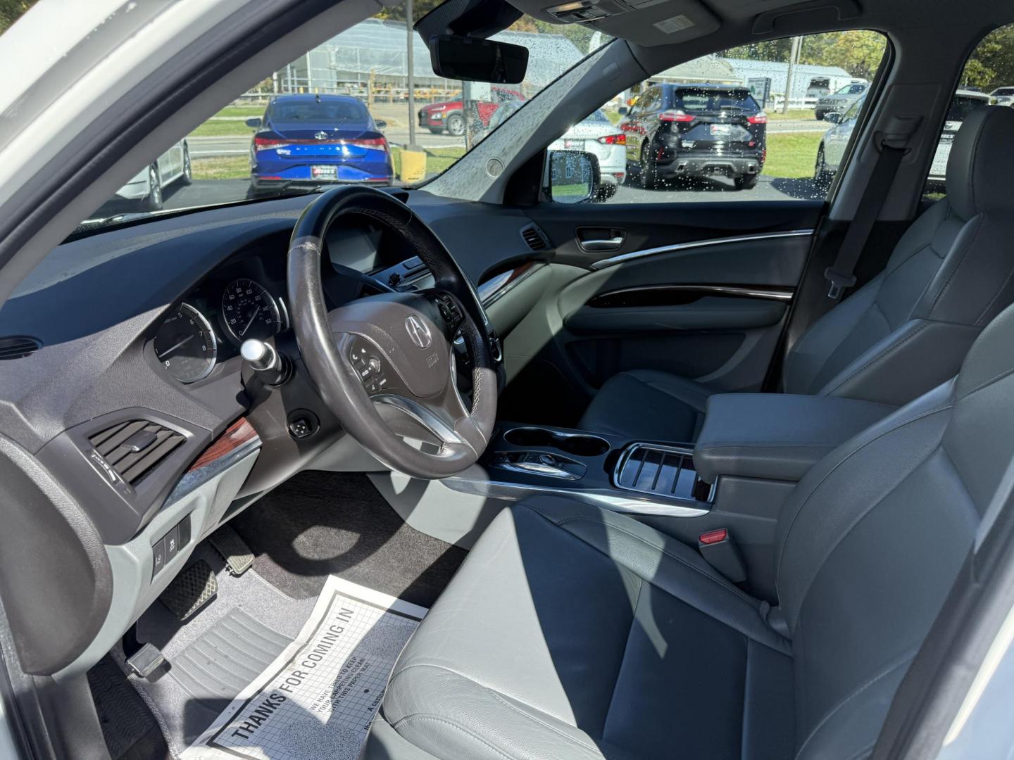 2016 White /Gray Acura MDX SH-AWD 9-Spd AT w/Tech Package (5FRYD4H47GB) with an 3.5L V6 SOHC 24V engine, 9-Speed Automatic transmission, located at 11115 Chardon Rd. , Chardon, OH, 44024, (440) 214-9705, 41.580246, -81.241943 - Step into luxury and versatility with this 2016 Acura MDX equipped with the Technology Package. Powered by a refined 3.5L V6 engine and smooth 9-speed automatic transmission, this SUV offers a sophisticated leather interior with power front seats, heated front seats, and tri-zone automatic climate c - Photo#15