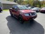 2016 Red /Gray Nissan Frontier SV Crew Cab 5AT 4WD (1N6AD0EV0GN) with an 4.0L V6 DOHC 24V engine, 5A transmission, located at 11115 Chardon Rd. , Chardon, OH, 44024, (440) 214-9705, 41.580246, -81.241943 - Tackle any job or adventure with this 2016 Nissan Frontier SV Crew Cab. Powered by a reliable 4.0L V6 engine and 5-speed automatic transmission, this truck offers a strong 6,300-pound towing capacity and is equipped with a Dana 44 rear axle for added durability. Enjoy added confidence on any terrain - Photo#2