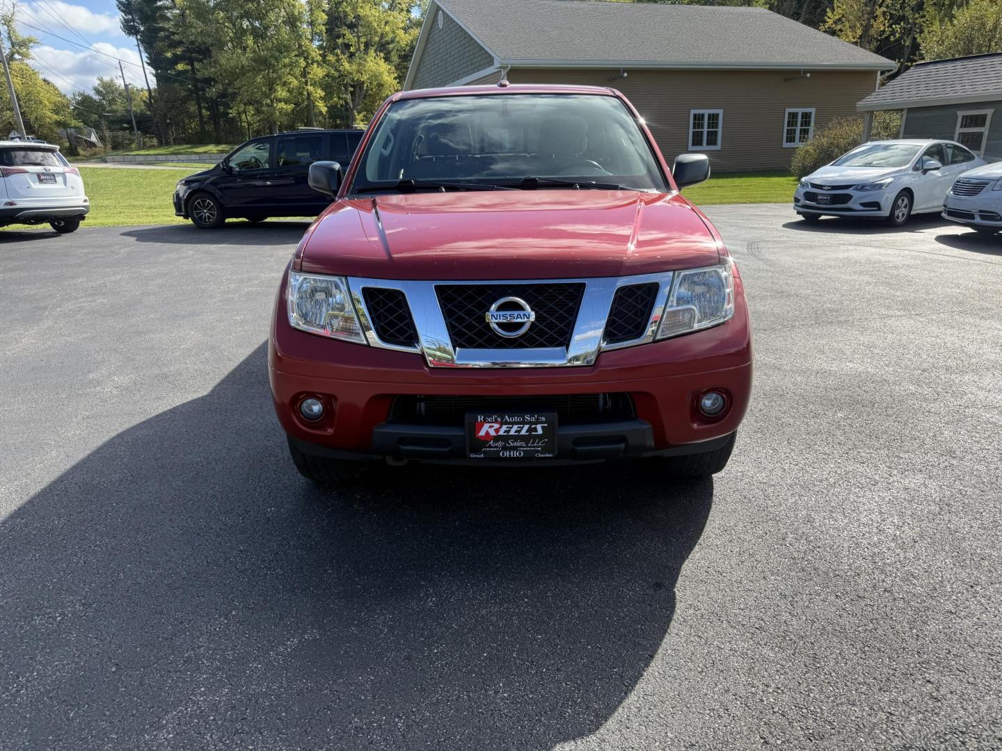 2016 Red /Gray Nissan Frontier SV Crew Cab 5AT 4WD (1N6AD0EV0GN) with an 4.0L V6 DOHC 24V engine, 5A transmission, located at 11115 Chardon Rd. , Chardon, OH, 44024, (440) 214-9705, 41.580246, -81.241943 - Tackle any job or adventure with this 2016 Nissan Frontier SV Crew Cab. Powered by a reliable 4.0L V6 engine and 5-speed automatic transmission, this truck offers a strong 6,300-pound towing capacity and is equipped with a Dana 44 rear axle for added durability. Enjoy added confidence on any terrain - Photo#1