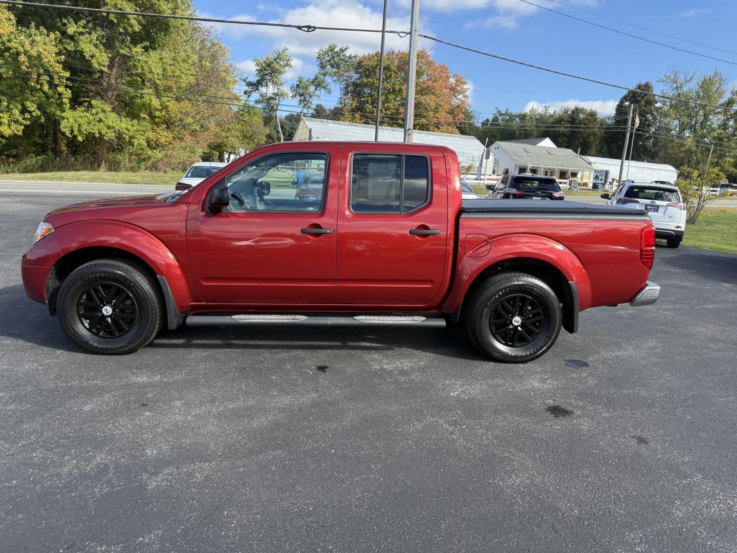 2016 Red /Gray Nissan Frontier SV Crew Cab 5AT 4WD (1N6AD0EV0GN) with an 4.0L V6 DOHC 24V engine, 5A transmission, located at 11115 Chardon Rd. , Chardon, OH, 44024, (440) 214-9705, 41.580246, -81.241943 - Tackle any job or adventure with this 2016 Nissan Frontier SV Crew Cab. Powered by a reliable 4.0L V6 engine and 5-speed automatic transmission, this truck offers a strong 6,300-pound towing capacity and is equipped with a Dana 44 rear axle for added durability. Enjoy added confidence on any terrain - Photo#14