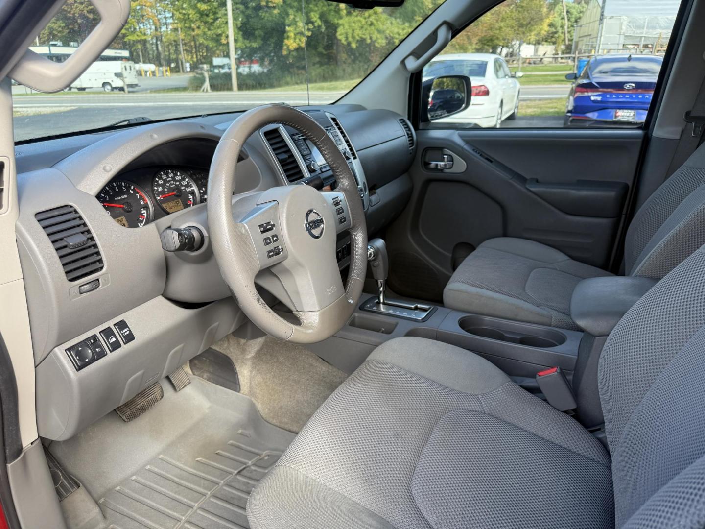 2016 Red /Gray Nissan Frontier SV Crew Cab 5AT 4WD (1N6AD0EV0GN) with an 4.0L V6 DOHC 24V engine, 5A transmission, located at 11115 Chardon Rd. , Chardon, OH, 44024, (440) 214-9705, 41.580246, -81.241943 - Tackle any job or adventure with this 2016 Nissan Frontier SV Crew Cab. Powered by a reliable 4.0L V6 engine and 5-speed automatic transmission, this truck offers a strong 6,300-pound towing capacity and is equipped with a Dana 44 rear axle for added durability. Enjoy added confidence on any terrain - Photo#18