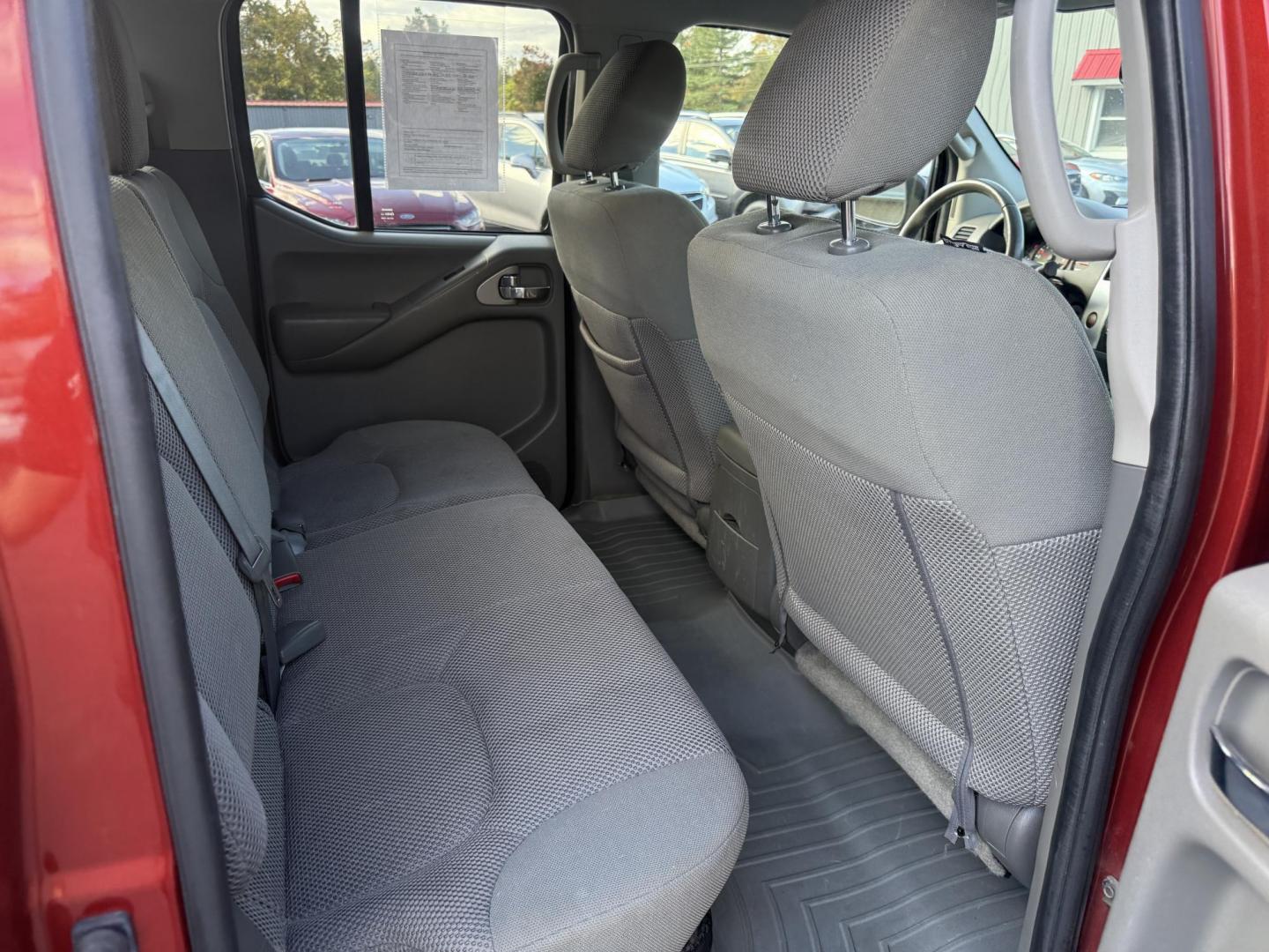 2016 Red /Gray Nissan Frontier SV Crew Cab 5AT 4WD (1N6AD0EV0GN) with an 4.0L V6 DOHC 24V engine, 5A transmission, located at 11115 Chardon Rd. , Chardon, OH, 44024, (440) 214-9705, 41.580246, -81.241943 - Tackle any job or adventure with this 2016 Nissan Frontier SV Crew Cab. Powered by a reliable 4.0L V6 engine and 5-speed automatic transmission, this truck offers a strong 6,300-pound towing capacity and is equipped with a Dana 44 rear axle for added durability. Enjoy added confidence on any terrain - Photo#40