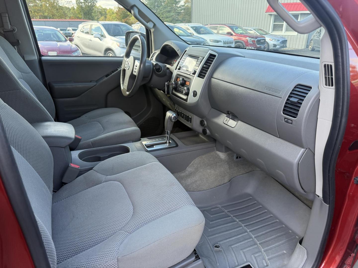 2016 Red /Gray Nissan Frontier SV Crew Cab 5AT 4WD (1N6AD0EV0GN) with an 4.0L V6 DOHC 24V engine, 5A transmission, located at 11115 Chardon Rd. , Chardon, OH, 44024, (440) 214-9705, 41.580246, -81.241943 - Tackle any job or adventure with this 2016 Nissan Frontier SV Crew Cab. Powered by a reliable 4.0L V6 engine and 5-speed automatic transmission, this truck offers a strong 6,300-pound towing capacity and is equipped with a Dana 44 rear axle for added durability. Enjoy added confidence on any terrain - Photo#42