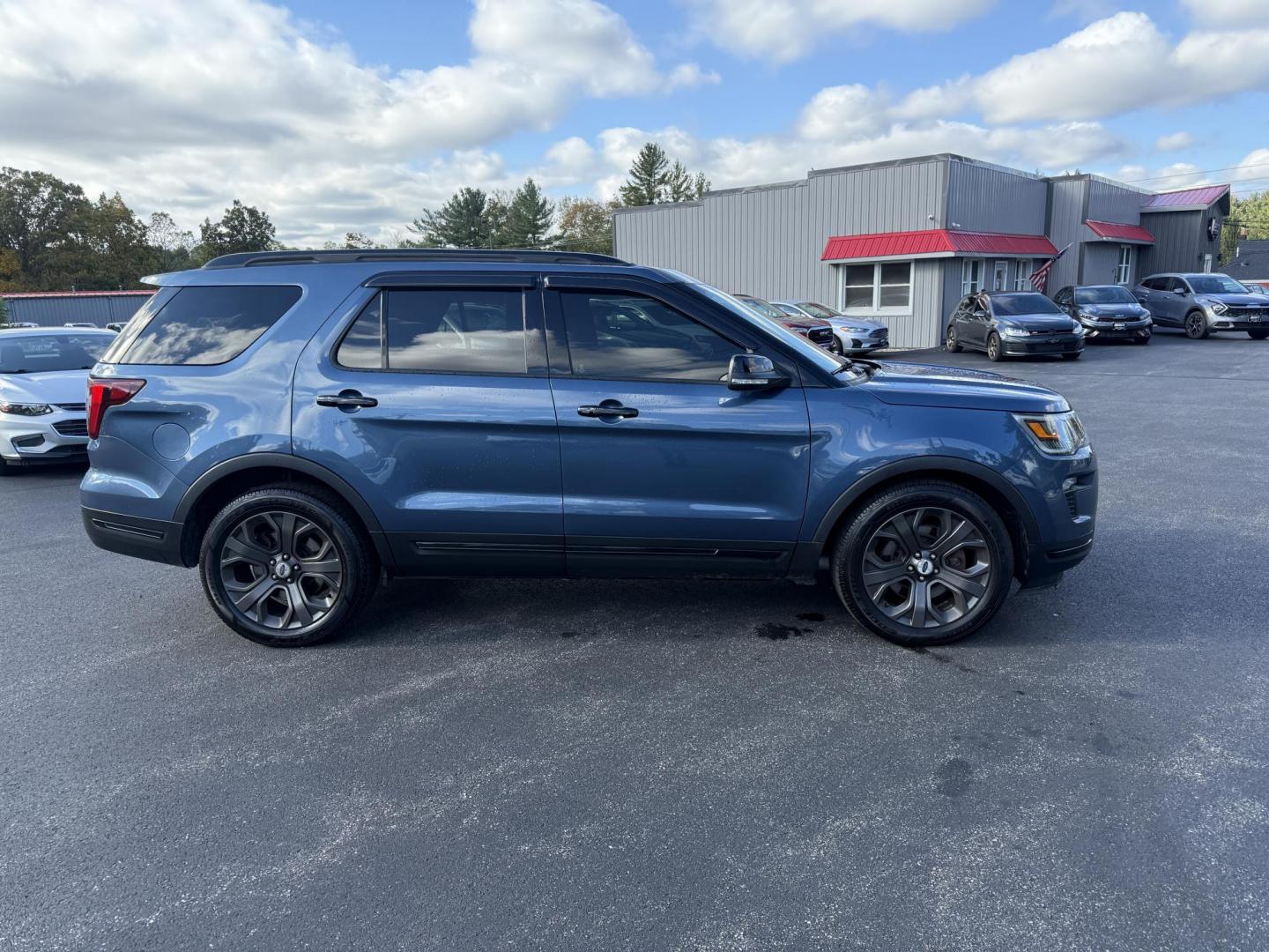 2018 Blue /Black Ford Explorer Sport 4WD (1FM5K8GT4JG) with an 3.5L V6 DOHC 24V TWIN TURBO engine, 6A transmission, located at 11115 Chardon Rd. , Chardon, OH, 44024, (440) 214-9705, 41.580246, -81.241943 - Experience thrilling performance and refined comfort in this 2018 Ford Explorer Sport 4WD. Powered by a 3.5L Twin Turbo EcoBoost V6 and a 6-speed automatic transmission, this SUV accelerates from 0 to 60 in just six seconds and offers a 5,000-pound towing capacity—perfect for adventure or family g - Photo#5