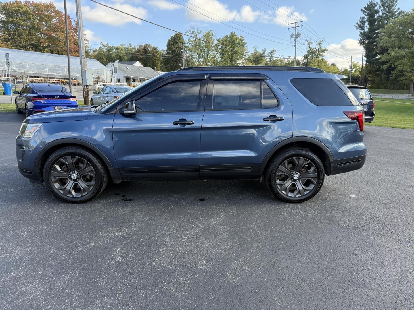 2018 Blue /Black Ford Explorer Sport 4WD (1FM5K8GT4JG) with an 3.5L V6 DOHC 24V TWIN TURBO engine, 6A transmission, located at 11115 Chardon Rd. , Chardon, OH, 44024, (440) 214-9705, 41.580246, -81.241943 - Experience thrilling performance and refined comfort in this 2018 Ford Explorer Sport 4WD. Powered by a 3.5L Twin Turbo EcoBoost V6 and a 6-speed automatic transmission, this SUV accelerates from 0 to 60 in just six seconds and offers a 5,000-pound towing capacity—perfect for adventure or family g - Photo#12