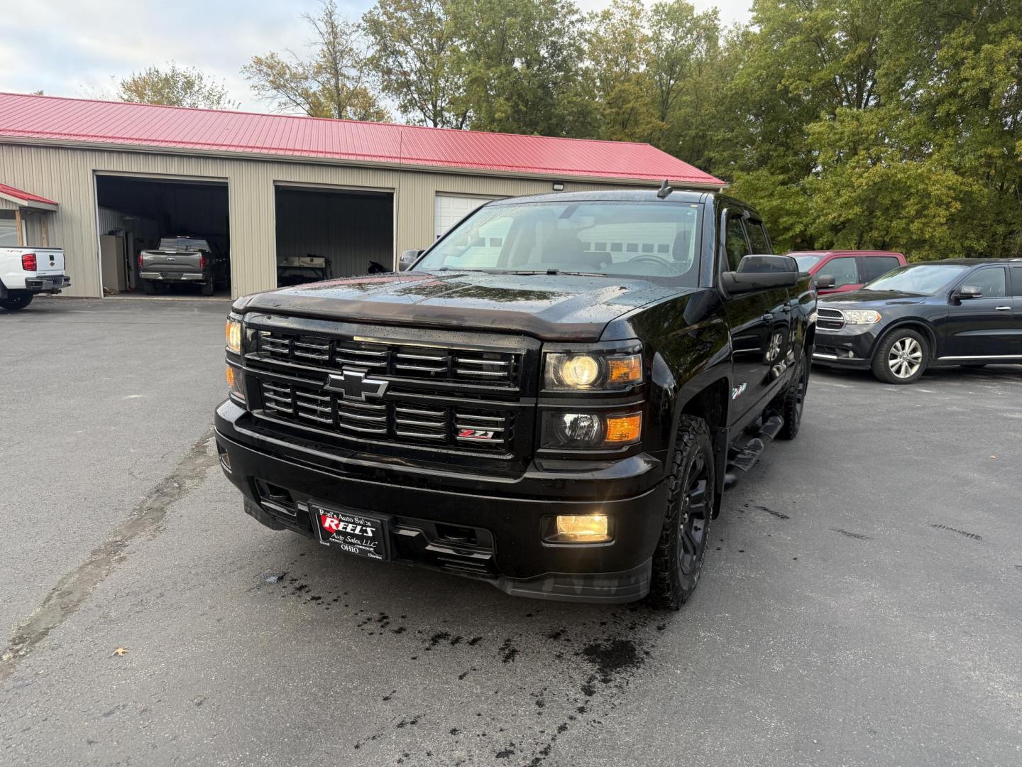 2015 Black /Black Chevrolet Silverado 1500 LT Z71 Double Cab 4WD (1GCVKREC5FZ) with an 5.3L V8 OHV 16V engine, 6-Speed Automatic transmission, located at 547 E. Main St., Orwell, OH, 44076, (440) 437-5893, 41.535435, -80.847855 - Tackle any road or job with this 2015 Chevrolet Silverado 1500 LT Z71 Double Cab 4WD. Powered by a capable 5.3L EcoTec3 V8 engine paired with a 6-speed automatic transmission and 3.42 gearing, this truck offers a robust 9,200-pound towing capacity. The Z71 Off Road Package and G80 locking rear diffe - Photo#0