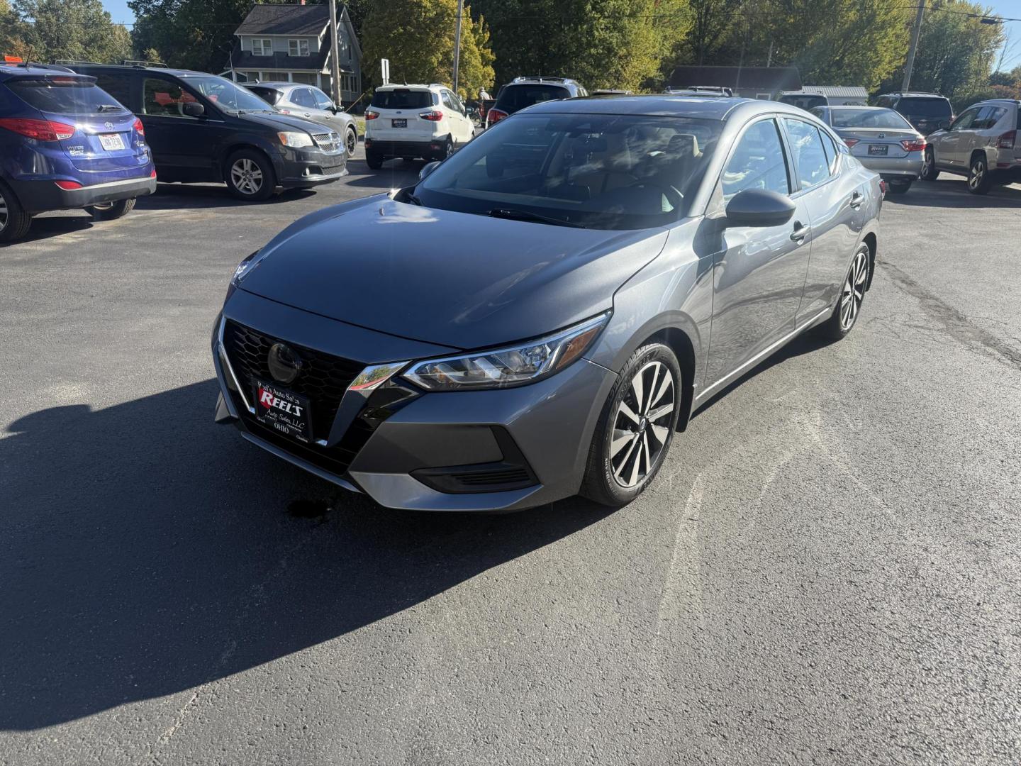 2022 Gray /Brown Nissan Sentra SV (3N1AB8CV3NY) with an 1.8L I4 SFI DOHC 16V engine, Automatic transmission, located at 547 E. Main St., Orwell, OH, 44076, (440) 437-5893, 41.535435, -80.847855 - Upgrade your daily drive with this 2022 Nissan Sentra SV, featuring the desirable SV Premium Package. Enjoy impressive efficiency with a 2.0L I4 engine delivering up to 39 MPG on the highway and 33 MPG combined. The refined interior boasts leather seating, a power driver’s seat, heated front seats - Photo#0