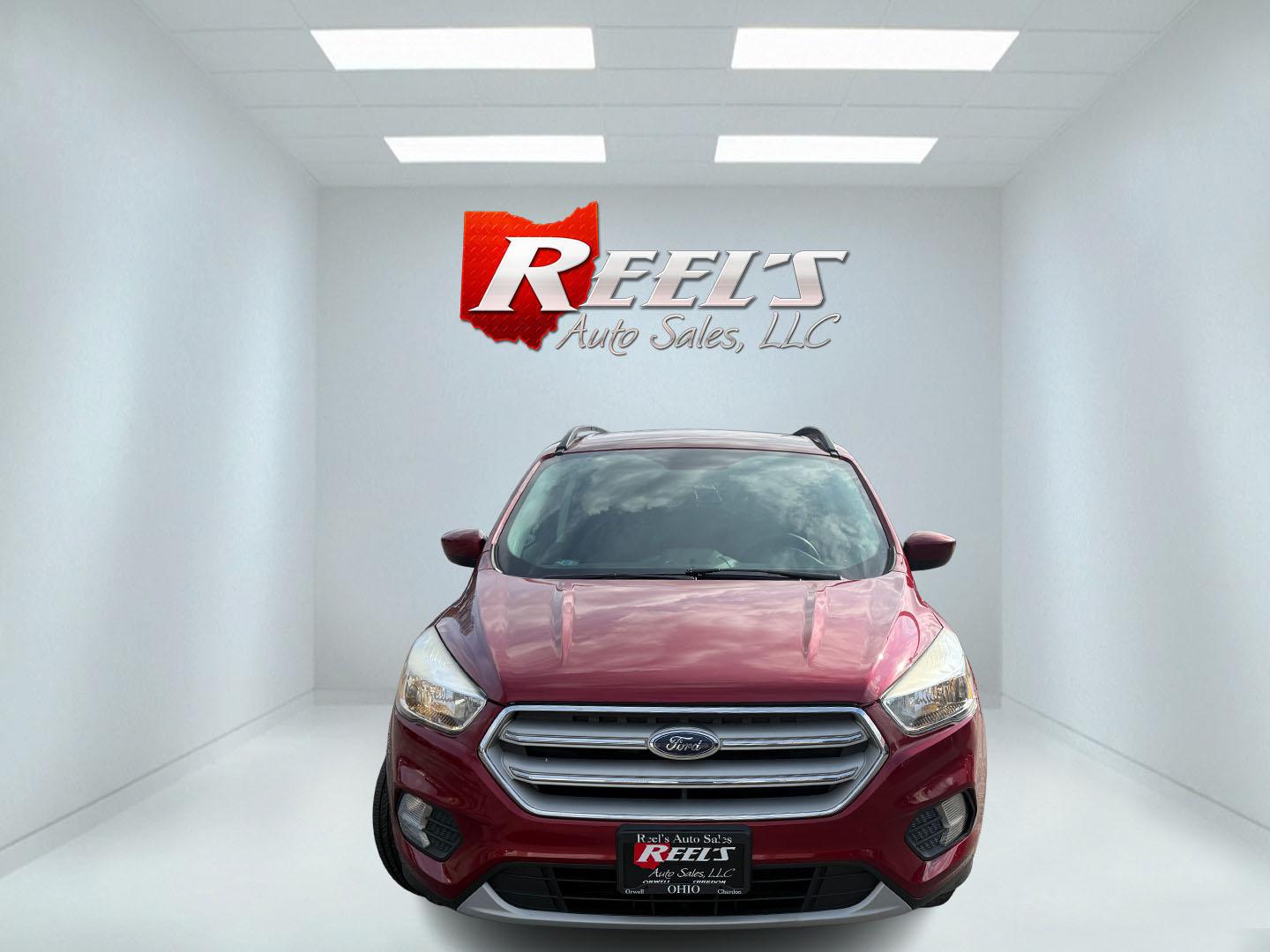 2018 Red /Black Ford Escape SE 4WD (1FMCU9GD5JU) with an 1.5L I4 DOHC 16V TURBO engine, Automatic transmission, located at 547 E. Main St., Orwell, OH, 44076, (440) 437-5893, 41.535435, -80.847855 - This 2018 Ford Escape SE 4WD is ready to roll with style, efficiency, and all the modern must-haves – your perfect everyday adventure machine! Powered by a peppy 1.5L I4 Turbocharged EcoBoost engine delivering smooth, responsive power through a slick 6-speed automatic transmission and confident 4 - Photo#1