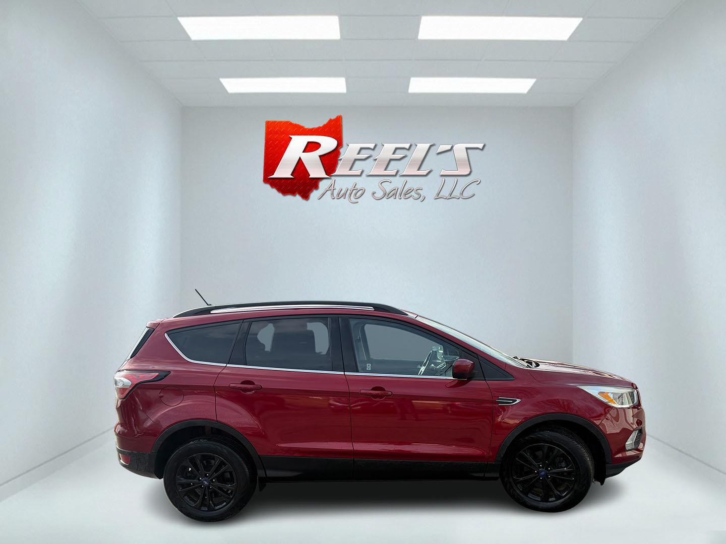 2018 Red /Black Ford Escape SE 4WD (1FMCU9GD5JU) with an 1.5L I4 DOHC 16V TURBO engine, Automatic transmission, located at 547 E. Main St., Orwell, OH, 44076, (440) 437-5893, 41.535435, -80.847855 - This 2018 Ford Escape SE 4WD is ready to roll with style, efficiency, and all the modern must-haves – your perfect everyday adventure machine! Powered by a peppy 1.5L I4 Turbocharged EcoBoost engine delivering smooth, responsive power through a slick 6-speed automatic transmission and confident 4 - Photo#23