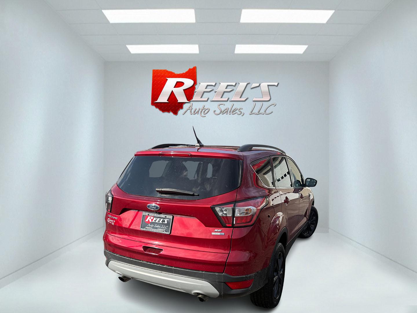 2018 Red /Black Ford Escape SE 4WD (1FMCU9GD5JU) with an 1.5L I4 DOHC 16V TURBO engine, Automatic transmission, located at 547 E. Main St., Orwell, OH, 44076, (440) 437-5893, 41.535435, -80.847855 - This 2018 Ford Escape SE 4WD is ready to roll with style, efficiency, and all the modern must-haves – your perfect everyday adventure machine! Powered by a peppy 1.5L I4 Turbocharged EcoBoost engine delivering smooth, responsive power through a slick 6-speed automatic transmission and confident 4 - Photo#25