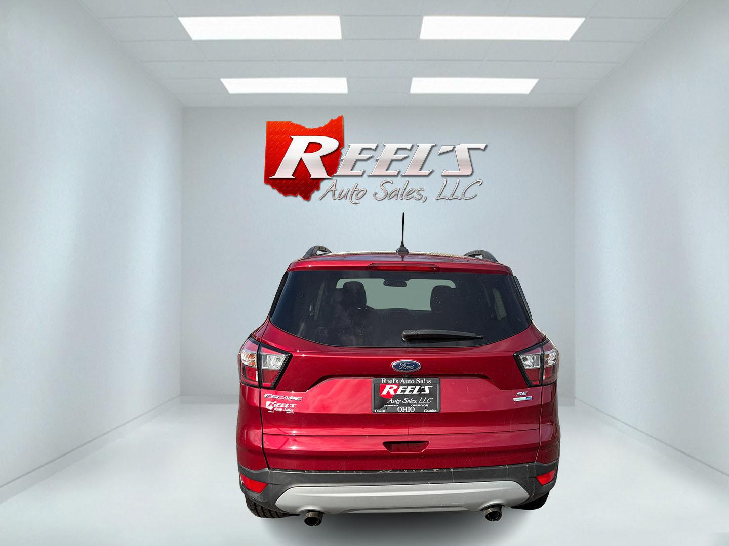 2018 Red /Black Ford Escape SE 4WD (1FMCU9GD5JU) with an 1.5L I4 DOHC 16V TURBO engine, Automatic transmission, located at 547 E. Main St., Orwell, OH, 44076, (440) 437-5893, 41.535435, -80.847855 - This 2018 Ford Escape SE 4WD is ready to roll with style, efficiency, and all the modern must-haves – your perfect everyday adventure machine! Powered by a peppy 1.5L I4 Turbocharged EcoBoost engine delivering smooth, responsive power through a slick 6-speed automatic transmission and confident 4 - Photo#26