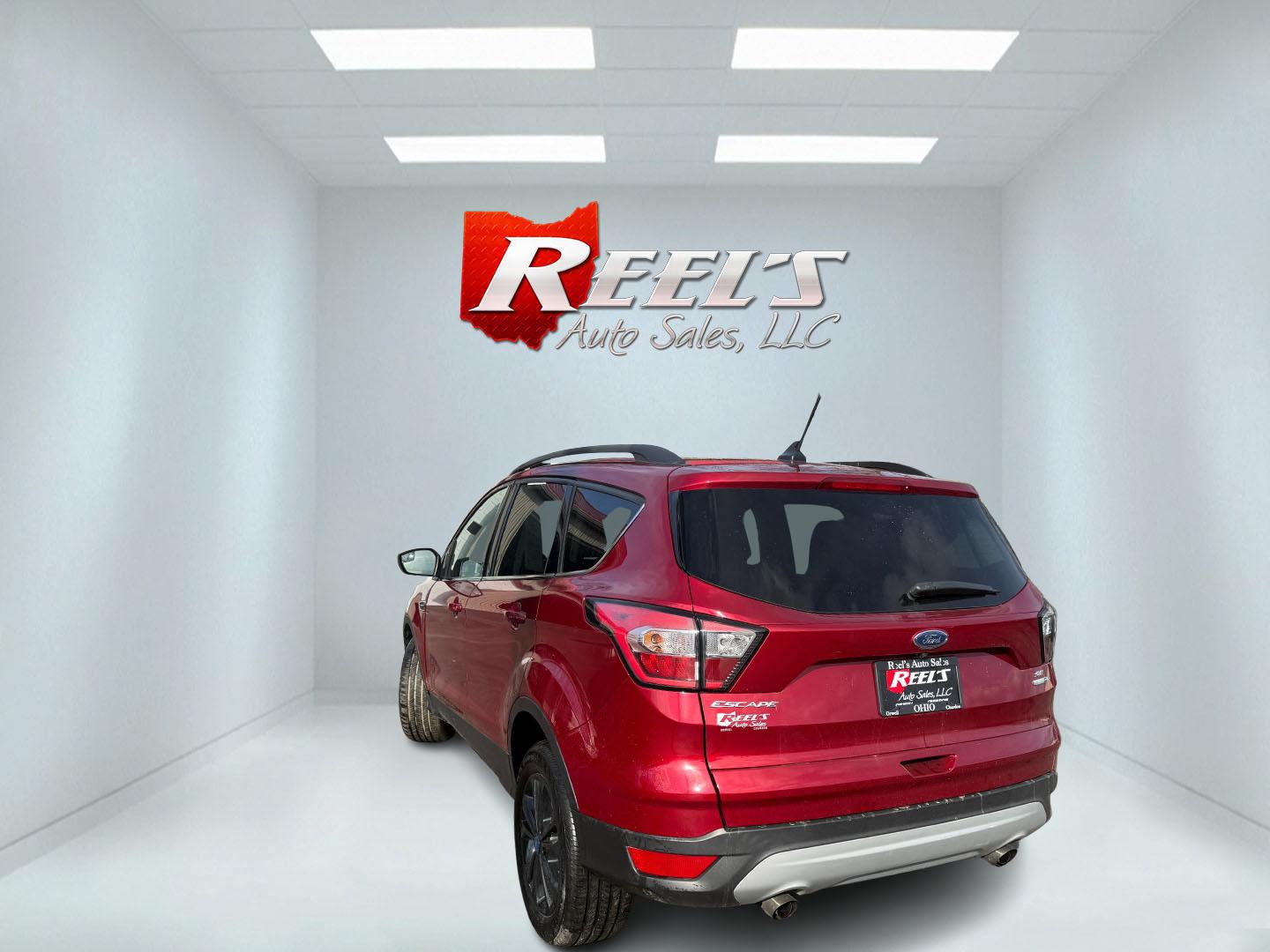 2018 Red /Black Ford Escape SE 4WD (1FMCU9GD5JU) with an 1.5L I4 DOHC 16V TURBO engine, Automatic transmission, located at 547 E. Main St., Orwell, OH, 44076, (440) 437-5893, 41.535435, -80.847855 - This 2018 Ford Escape SE 4WD is ready to roll with style, efficiency, and all the modern must-haves – your perfect everyday adventure machine! Powered by a peppy 1.5L I4 Turbocharged EcoBoost engine delivering smooth, responsive power through a slick 6-speed automatic transmission and confident 4 - Photo#27