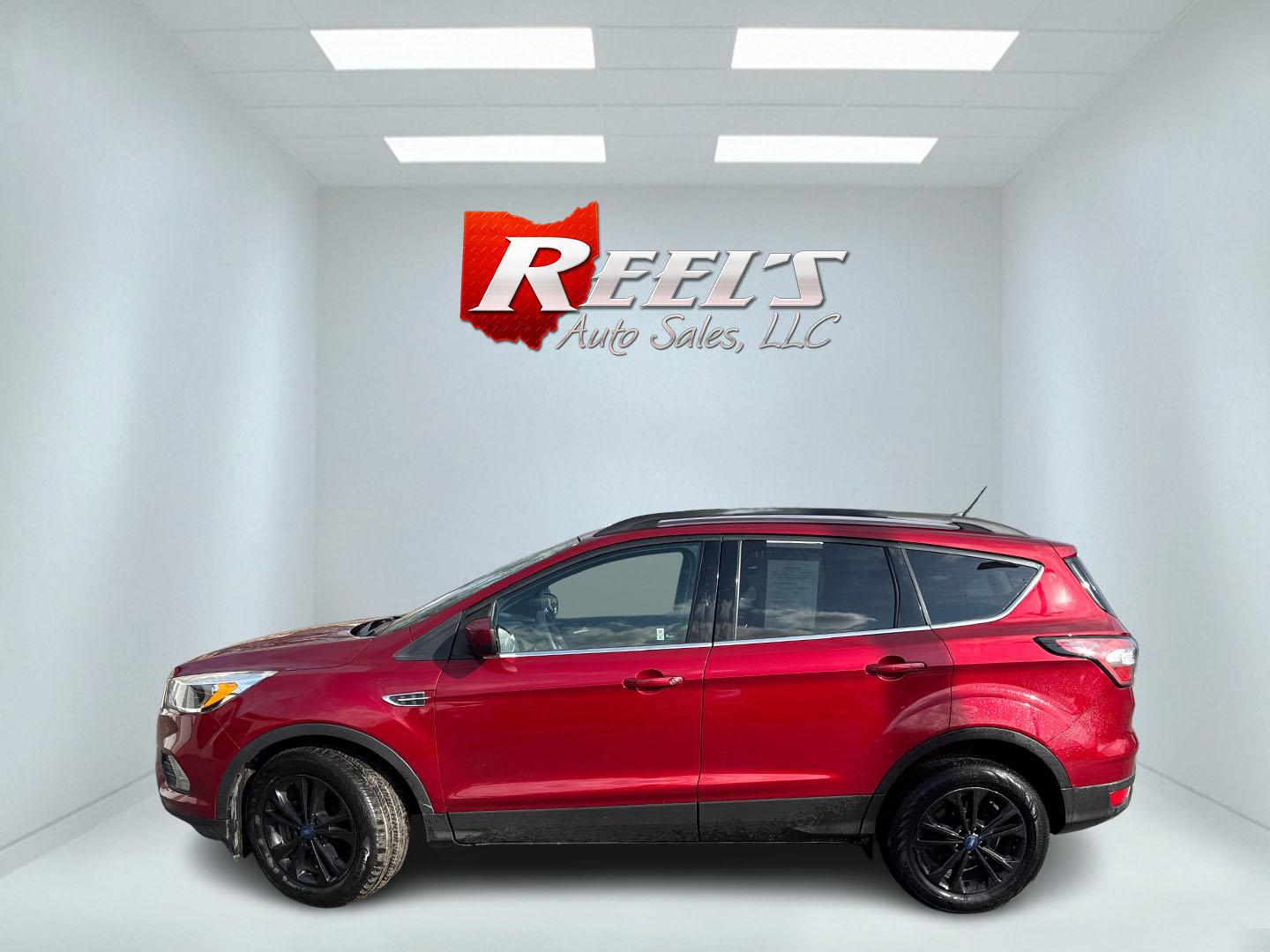2018 Red /Black Ford Escape SE 4WD (1FMCU9GD5JU) with an 1.5L I4 DOHC 16V TURBO engine, Automatic transmission, located at 547 E. Main St., Orwell, OH, 44076, (440) 437-5893, 41.535435, -80.847855 - This 2018 Ford Escape SE 4WD is ready to roll with style, efficiency, and all the modern must-haves – your perfect everyday adventure machine! Powered by a peppy 1.5L I4 Turbocharged EcoBoost engine delivering smooth, responsive power through a slick 6-speed automatic transmission and confident 4 - Photo#30