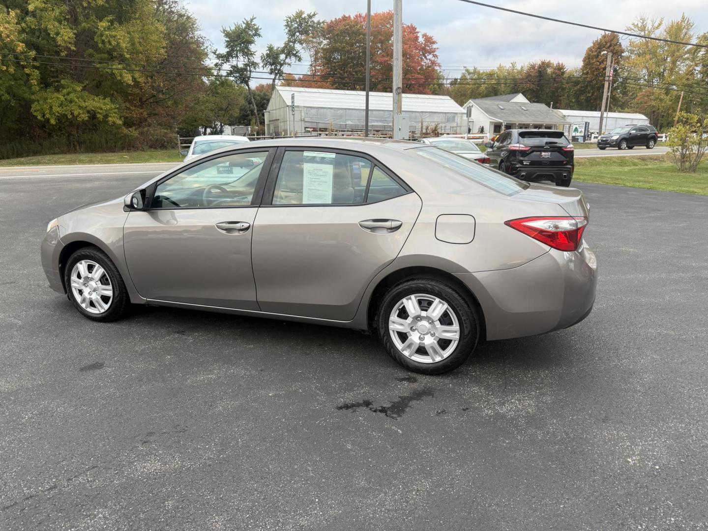 2016 Gray /Tan Toyota Corolla LE (2T1BURHE6GC) with an 1.8L I4 DOHC 16V engine, Automatic transmission, located at 11115 Chardon Rd. , Chardon, OH, 44024, (440) 214-9705, 41.580246, -81.241943 - Enjoy reliability, efficiency, and comfort in this 2016 Toyota Corolla LE. Powered by a fuel-efficient 1.8L I4 engine, this sedan delivers up to 37 MPG on the highway and features selectable ECO and Sport modes for a personalized driving experience. The well-appointed interior includes single zone a - Photo#10