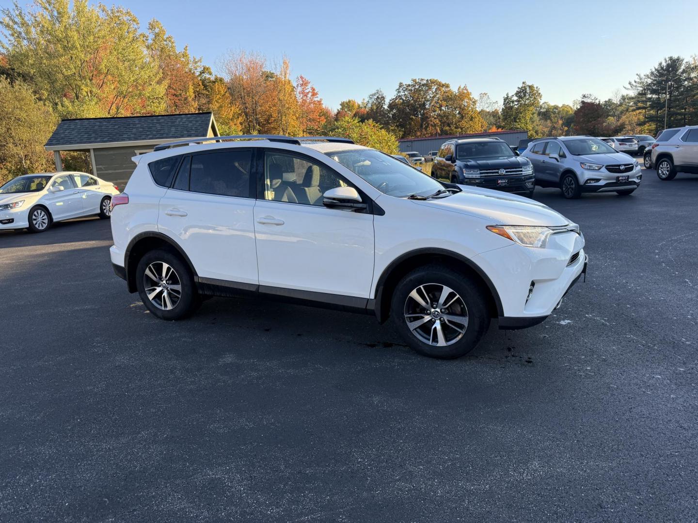 2017 White /Black Toyota RAV4 XLE AWD (JTMRFREV9HJ) with an 2.5LI4 DOHC 16V engine, 6A transmission, located at 11115 Chardon Rd. , Chardon, OH, 44024, (440) 214-9705, 41.580246, -81.241943 - 2017 Toyota RAV4 XLE AWD – Efficient, Smart, and Ready for Adventure Take on any journey with confidence in this 2017 Toyota RAV4 XLE AWD. Powered by a fuel-efficient 2.5L I4 engine and 6-speed automatic transmission, this SUV delivers 28 MPG on the highway, while Sport and ECO modes let you ta - Photo#3