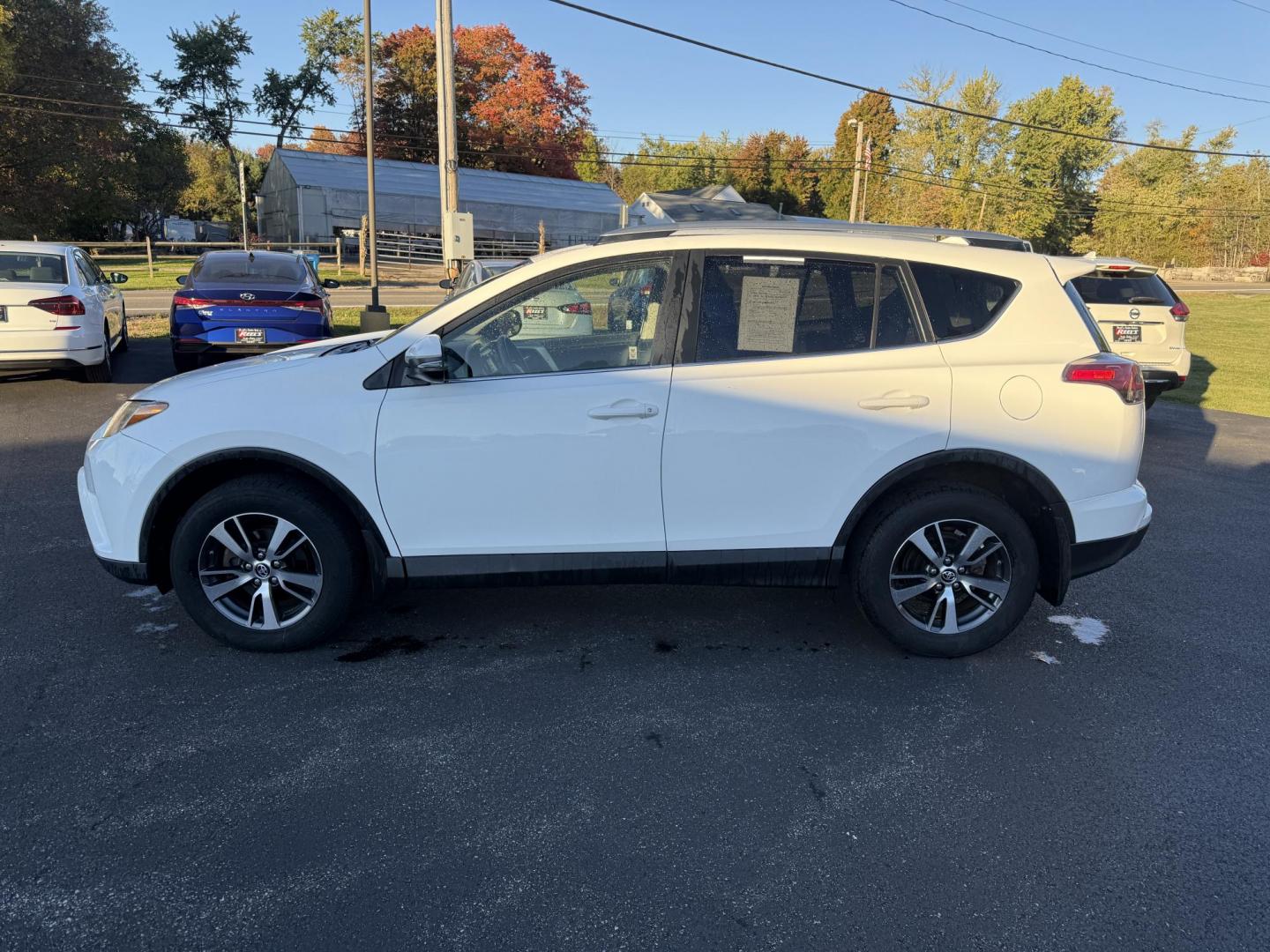 2017 White /Black Toyota RAV4 XLE AWD (JTMRFREV9HJ) with an 2.5LI4 DOHC 16V engine, 6A transmission, located at 11115 Chardon Rd. , Chardon, OH, 44024, (440) 214-9705, 41.580246, -81.241943 - 2017 Toyota RAV4 XLE AWD – Efficient, Smart, and Ready for Adventure Take on any journey with confidence in this 2017 Toyota RAV4 XLE AWD. Powered by a fuel-efficient 2.5L I4 engine and 6-speed automatic transmission, this SUV delivers 28 MPG on the highway, while Sport and ECO modes let you ta - Photo#12