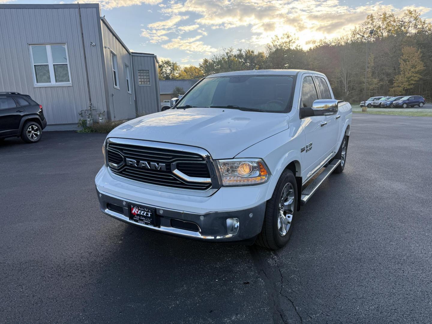 2017 White /Black RAM 1500 Limited Crew Cab SWB 4WD (1C6RR7PT4HS) with an 5.7L V8 OHV 16V engine, 8A transmission, located at 11115 Chardon Rd. , Chardon, OH, 44024, (440) 214-9705, 41.580246, -81.241943 - 2017 Ram 1500 Crew Cab Limited 4WD – Luxury and Power Combined Experience top-tier performance and comfort in this 2017 Ram 1500 Crew Cab Limited 4WD. Powered by a legendary 5.7L HEMI V8 engine with 395 HP and 410 lb-ft of torque, this truck offers an 8-speed automatic transmission, on-demand 4 - Photo#0