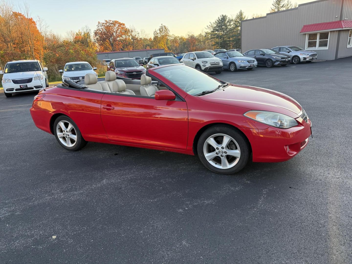 2005 Red /Tan Toyota Camry Solara XSE Convertible (4T1FA38P05U) with an 3.3L V6 DOHC 24V engine, Automatic transmission, located at 11115 Chardon Rd. , Chardon, OH, 44024, (440) 214-9705, 41.580246, -81.241943 - 2005 Toyota Camry Solara XSE – Stylish, Fun, and Loaded with Premium Features Turn heads in this sleek 2005 Toyota Camry Solara XSE. Powered by a smooth 3.3L V6 engine paired with a 5-speed automatic transmission, this sporty convertible offers a thrilling drive with the convenience of a power - Photo#3