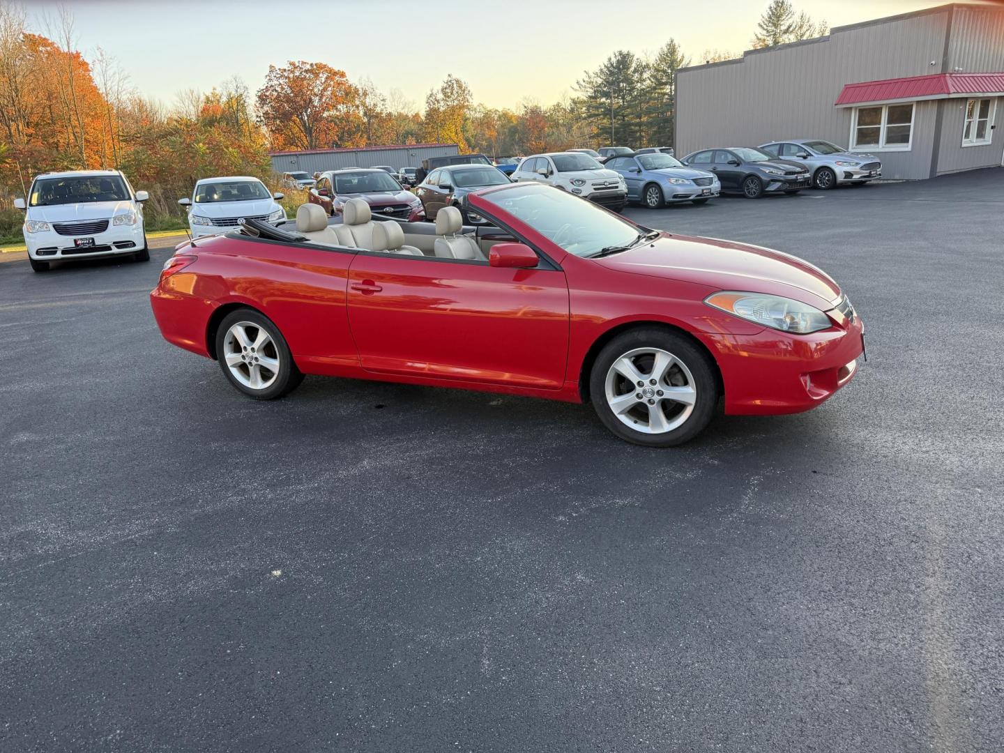 2005 Red /Tan Toyota Camry Solara XSE Convertible (4T1FA38P05U) with an 3.3L V6 DOHC 24V engine, Automatic transmission, located at 11115 Chardon Rd. , Chardon, OH, 44024, (440) 214-9705, 41.580246, -81.241943 - 2005 Toyota Camry Solara XSE – Stylish, Fun, and Loaded with Premium Features Turn heads in this sleek 2005 Toyota Camry Solara XSE. Powered by a smooth 3.3L V6 engine paired with a 5-speed automatic transmission, this sporty convertible offers a thrilling drive with the convenience of a power - Photo#5