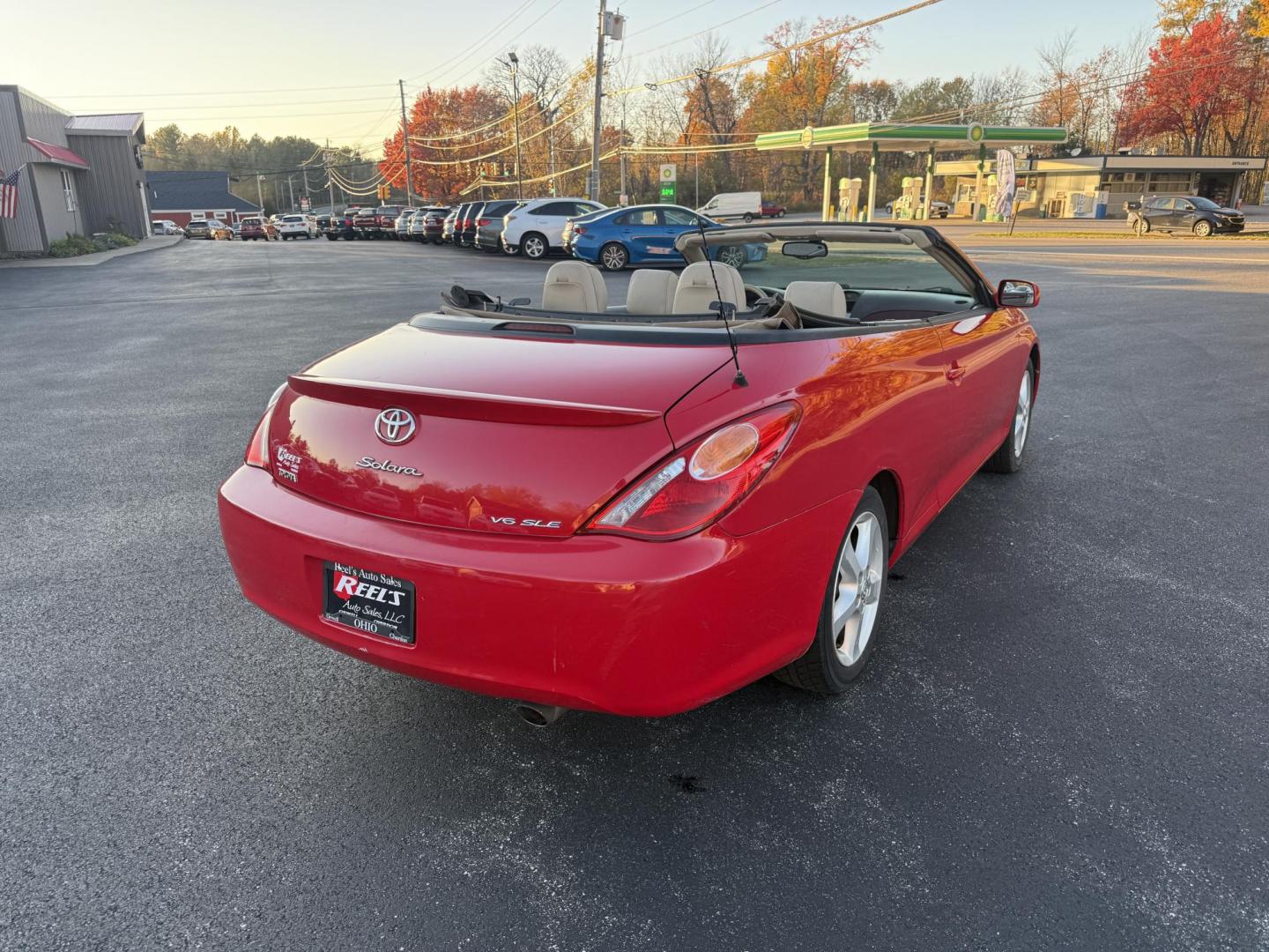 2005 Red /Tan Toyota Camry Solara XSE Convertible (4T1FA38P05U) with an 3.3L V6 DOHC 24V engine, Automatic transmission, located at 11115 Chardon Rd. , Chardon, OH, 44024, (440) 214-9705, 41.580246, -81.241943 - 2005 Toyota Camry Solara XSE – Stylish, Fun, and Loaded with Premium Features Turn heads in this sleek 2005 Toyota Camry Solara XSE. Powered by a smooth 3.3L V6 engine paired with a 5-speed automatic transmission, this sporty convertible offers a thrilling drive with the convenience of a power - Photo#7