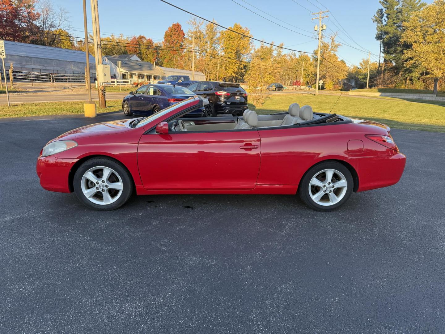 2005 Red /Tan Toyota Camry Solara XSE Convertible (4T1FA38P05U) with an 3.3L V6 DOHC 24V engine, Automatic transmission, located at 11115 Chardon Rd. , Chardon, OH, 44024, (440) 214-9705, 41.580246, -81.241943 - 2005 Toyota Camry Solara XSE – Stylish, Fun, and Loaded with Premium Features Turn heads in this sleek 2005 Toyota Camry Solara XSE. Powered by a smooth 3.3L V6 engine paired with a 5-speed automatic transmission, this sporty convertible offers a thrilling drive with the convenience of a power - Photo#13