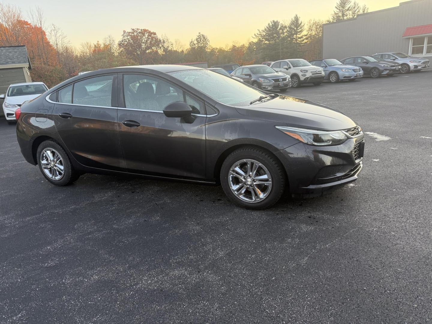 2017 Gray /Black Chevrolet Cruze LT Auto (1G1BE5SMXH7) with an 1.4L I4 DOHC 16V TURBO engine, Automatic transmission, located at 11115 Chardon Rd. , Chardon, OH, 44024, (440) 214-9705, 41.580246, -81.241943 - 2017 Chevrolet Cruze LT – Turbocharged Efficiency, Modern Comfort, and Smart Technology Experience a blend of spirited performance and fuel-saving efficiency in this 2017 Chevrolet Cruze LT. Its 1.4L EcoTec turbocharged engine and 6-speed automatic transmission deliver a fun drive and outstandi - Photo#3