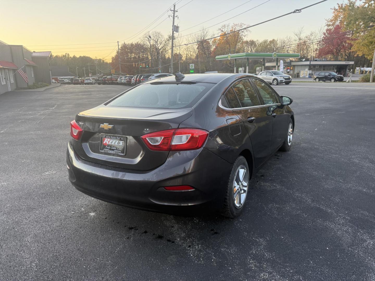 2017 Gray /Black Chevrolet Cruze LT Auto (1G1BE5SMXH7) with an 1.4L I4 DOHC 16V TURBO engine, Automatic transmission, located at 11115 Chardon Rd. , Chardon, OH, 44024, (440) 214-9705, 41.580246, -81.241943 - 2017 Chevrolet Cruze LT – Turbocharged Efficiency, Modern Comfort, and Smart Technology Experience a blend of spirited performance and fuel-saving efficiency in this 2017 Chevrolet Cruze LT. Its 1.4L EcoTec turbocharged engine and 6-speed automatic transmission deliver a fun drive and outstandi - Photo#7
