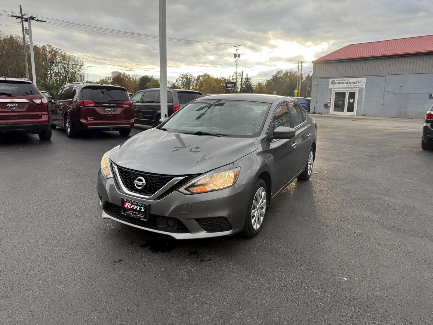 2019 Gray /Black Nissan Sentra S CVT (3N1AB7APXKY) with an 1.8L I4 SFI DOHC 16V engine, Automatic transmission, located at 547 E. Main St., Orwell, OH, 44076, (440) 437-5893, 41.535435, -80.847855 - ONE OWNER – 2019 Nissan Sentra S – Exceptional Efficiency, Modern Tech, and Everyday Confidence Drive smart and save with this 2019 Nissan Sentra S, offering an efficient 1.8L I4 engine that delivers 32 MPG combined and up to 37 MPG highway. With ECO mode, you’ll maximize every mile—perfe - Photo#0