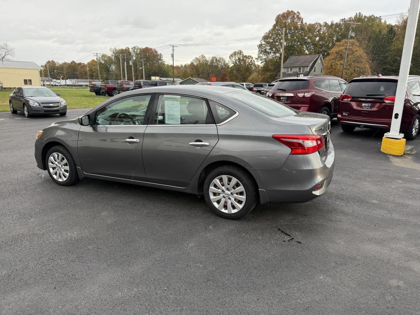 2019 Gray /Black Nissan Sentra S CVT (3N1AB7APXKY) with an 1.8L I4 SFI DOHC 16V engine, Automatic transmission, located at 547 E. Main St., Orwell, OH, 44076, (440) 437-5893, 41.535435, -80.847855 - ONE OWNER – 2019 Nissan Sentra S – Exceptional Efficiency, Modern Tech, and Everyday Confidence Drive smart and save with this 2019 Nissan Sentra S, offering an efficient 1.8L I4 engine that delivers 32 MPG combined and up to 37 MPG highway. With ECO mode, you’ll maximize every mile—perfe - Photo#10