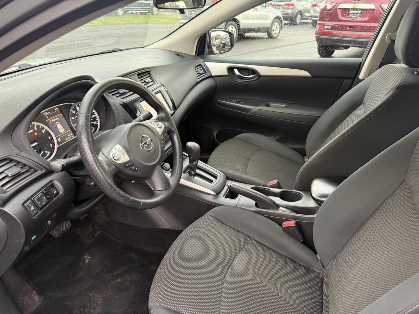 2019 Gray /Black Nissan Sentra S CVT (3N1AB7APXKY) with an 1.8L I4 SFI DOHC 16V engine, Automatic transmission, located at 547 E. Main St., Orwell, OH, 44076, (440) 437-5893, 41.535435, -80.847855 - ONE OWNER – 2019 Nissan Sentra S – Exceptional Efficiency, Modern Tech, and Everyday Confidence Drive smart and save with this 2019 Nissan Sentra S, offering an efficient 1.8L I4 engine that delivers 32 MPG combined and up to 37 MPG highway. With ECO mode, you’ll maximize every mile—perfe - Photo#15